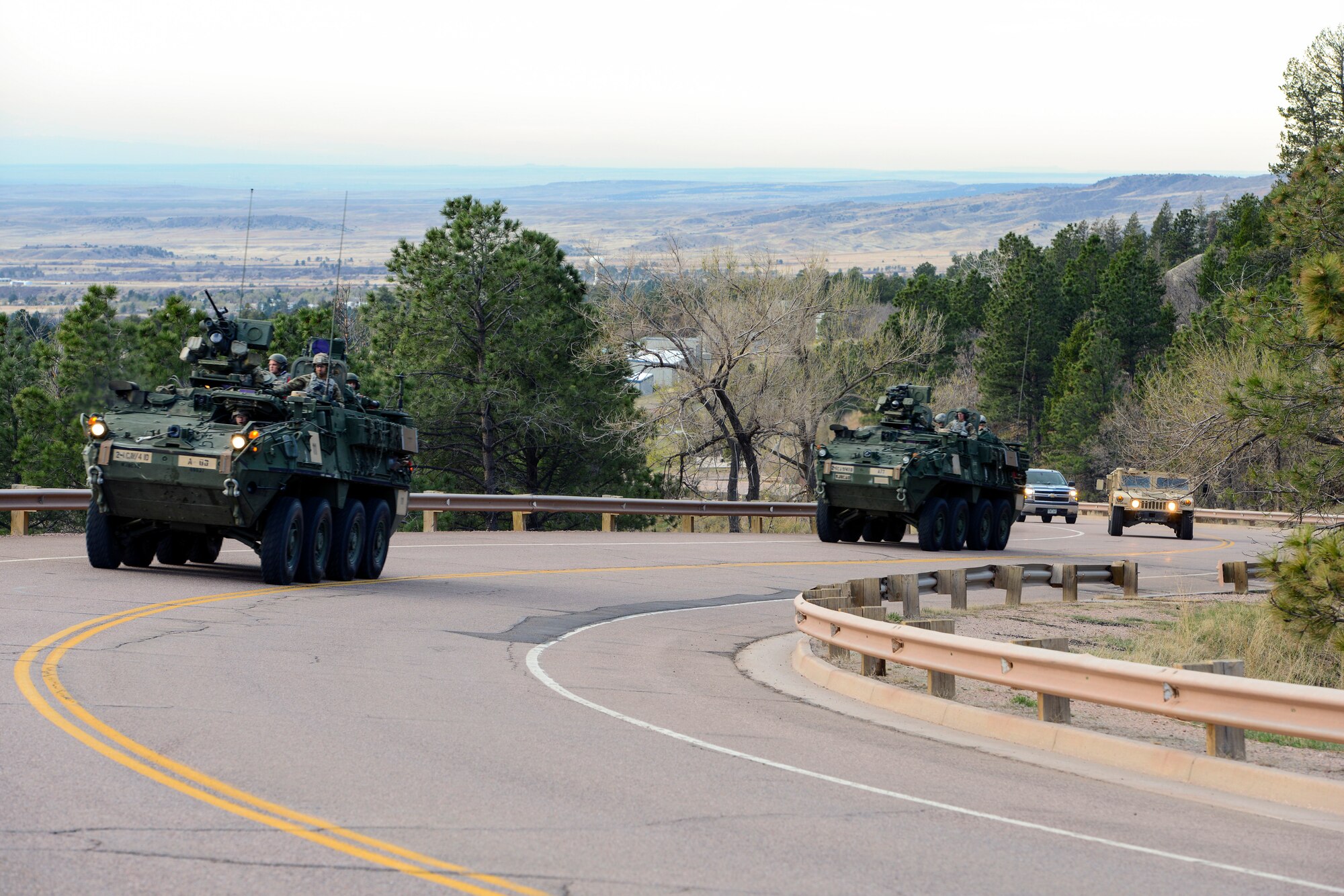 CHEYENNE MOUNTAIN AIR FORCE STATION, Colo. - Stryker vehicles from the 1st Stryker Brigade Combat Team, 4th Infantry Division at Fort Carson, Colo., make the climb up Cheyenne Mountain Road to help support the 50th Anniversary Rededication Ceremony at Cheyenne Mountain Air Force Station, April 15, 2016. Since its inception during the Cold War through the war on terrorism, Cheyenne Mountain has remained critical to the defense mission providing command and control for the nation since 1966. Cheyenne Mountain AFS is owned by the 21st Space Wing at Peterson Air Force Base, and operated by the 721st Mission Support Group. (U.S. Air Force photo by Master Sgt. Jared Marquis)