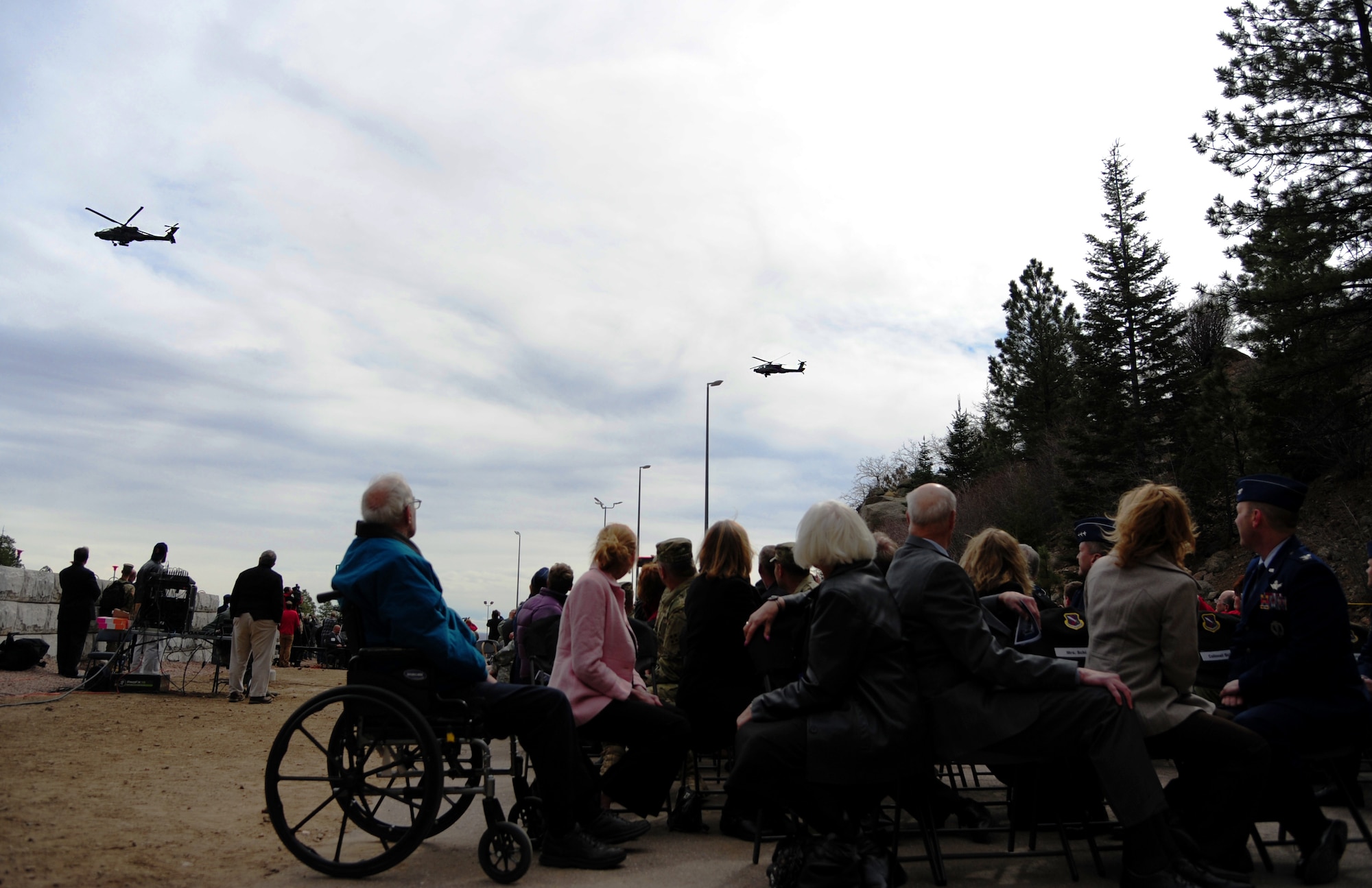 CHEYENNE MOUNTAIN AIR FORCE STATION, Colo. - A pair of AH-64 Apache attack helicopters, 4th Combat Aviation Brigade, 4th Infantry Division, perform a flyover during the 50th Anniversary Rededication Ceremony at Cheyenne Mountain Air Force Station April 15, 2016. With the nickname America's Fortress, CMAFS is situated beneath 2,000 feet of granite and consists of 15 buildings resting on more than 1,300 enormous steel springs. Cheyenne Mountain AFS is owned by the 21st Space Wing at Peterson Air Force Base, and operated by the 721st Mission Support Group. (U.S. Air Force photo by Staff Sgt. Amber Grimm)