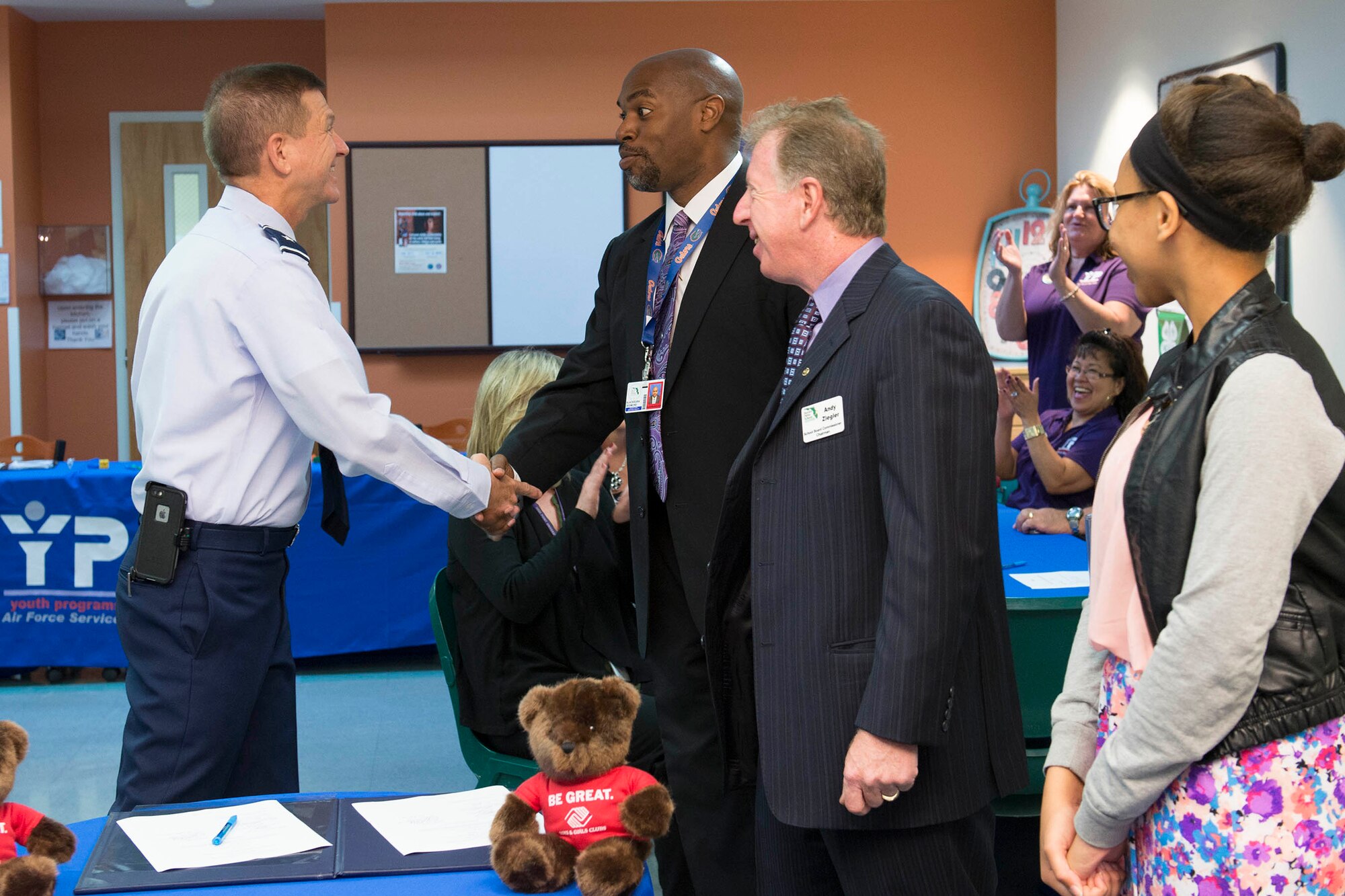 Brig. Gen. Wayne Monteith, 45th Space Wing commander, shakes hands with Desmond Blackburn, Ph.D., Brevard Public Schools superintendent, following the signing of a memorandum of agreement between Patrick Air Force Base and Brevard Schools April 15, 2016, at the Patrick AFB Youth Center, Florida. The agreement is designed to address the transition of military dependent students in a way that models and exemplifies partnership, flexibility, inclusiveness and information sharing for all schools that serve military dependent students. (U.S. Air Force photo by Matthew Jurgens/released)