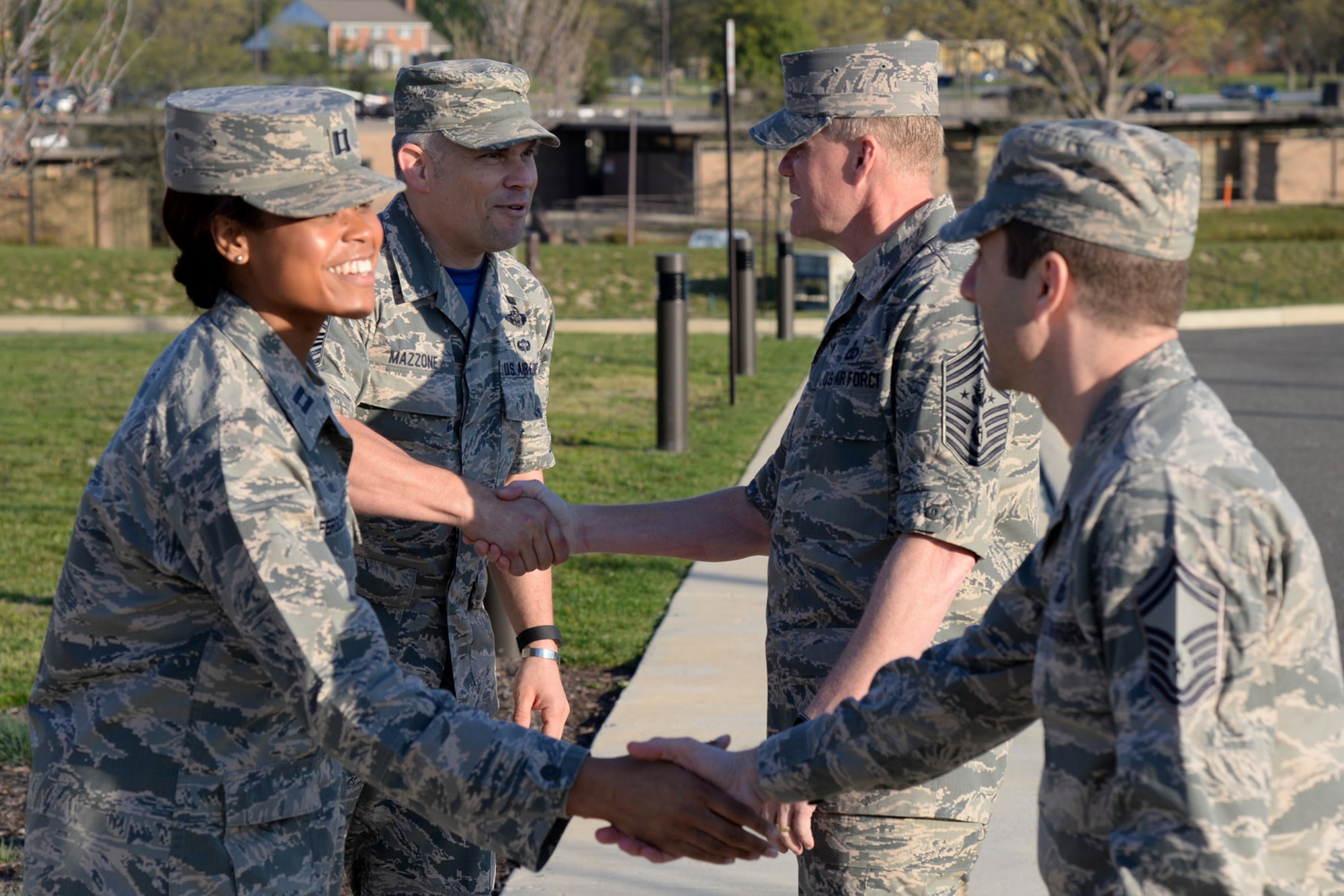 Air Force District of Washington Command Chief Master Sgt. Tommy Mazzone greets Chief Master Sergeant of the Air Force James Cody during the National Capital region Joint-Service Junior Officer Leadership Summit held at the General Jacob E. Smart Conference Center on Joint Base Andrews, Md., April 15, 2016. The course is designed to develop joint service junior officers by exchanging ideas with their peers and through mentoring by senior military leadership. (U.S. Air Force photo/Tech. Sgt. Matt Davis)