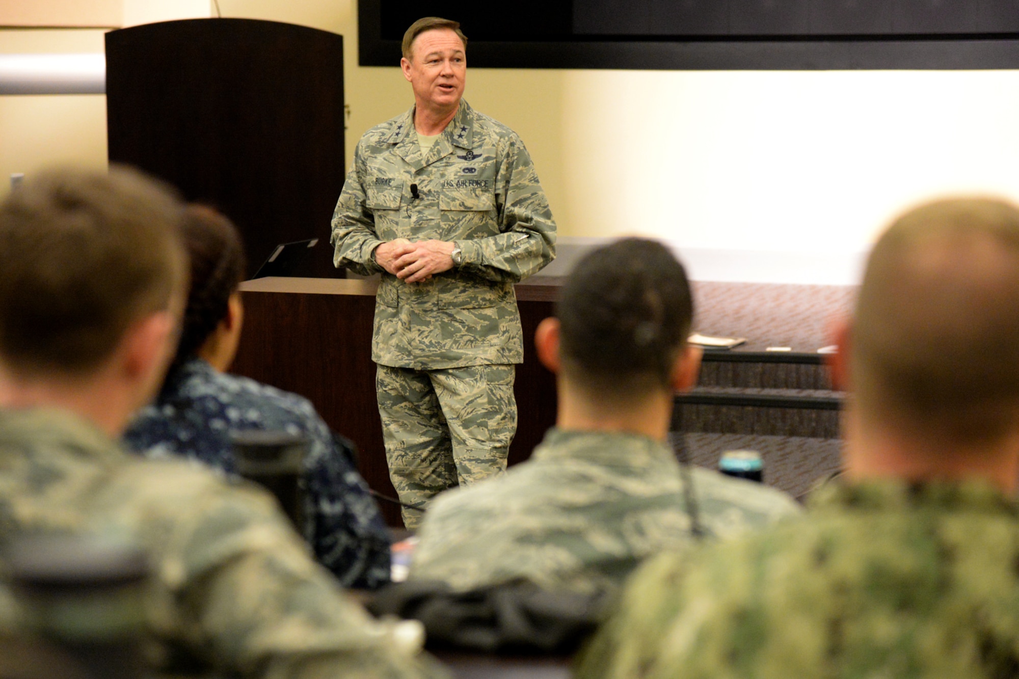 Air Force District of Washington Commander Maj. Gen. Darryl Burke speaks to attendees during the National Capital region Joint-Service Junior Officer Leadership Summit held at the General Jacob E. Smart Conference Center on Joint Base Andrews, Md., April 15, 2016. The course is designed to develop joint service junior officers by exchanging ideas with their peers and through mentoring by senior military leadership. (U.S. Air Force photo/Tech. Sgt. Matt Davis)