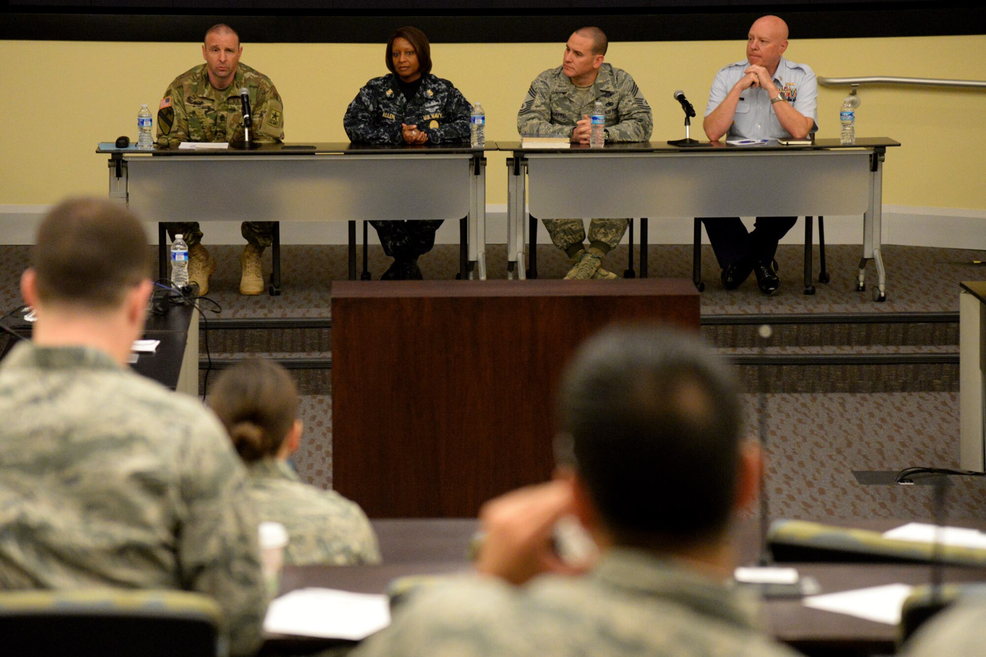 Sgt. Maj. Dennis Eger, Office of the Sergeant Major of the Army, Command Master Chief Dee Allen, United States Navy Headquarters, Chief Master Sgt. Kevin Kloeppel, Joint Base Anacostia-Bolling Senior Enlisted Leader and Command Master Chief Shane Hooker, United States Coast Guard Headquarters speak to attendees during the National Capital region Joint-Service Junior Officer Leadership Summit held at the General Jacob E. Smart Conference Center on Joint Base Andrews, Md., April 15, 2016. The course is designed to develop joint service junior officers by exchanging ideas with their peers and through mentoring by senior military leadership.  (U.S. Air Force photo/Tech. Sgt. Matt Davis)