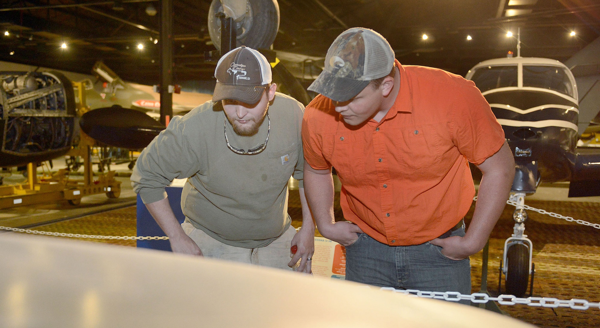 John Paul (left) and Dalton Quarles of Warner Robins view exhibits in Hangar One.  (U.S. Air Force photo by Tommie Horton)
