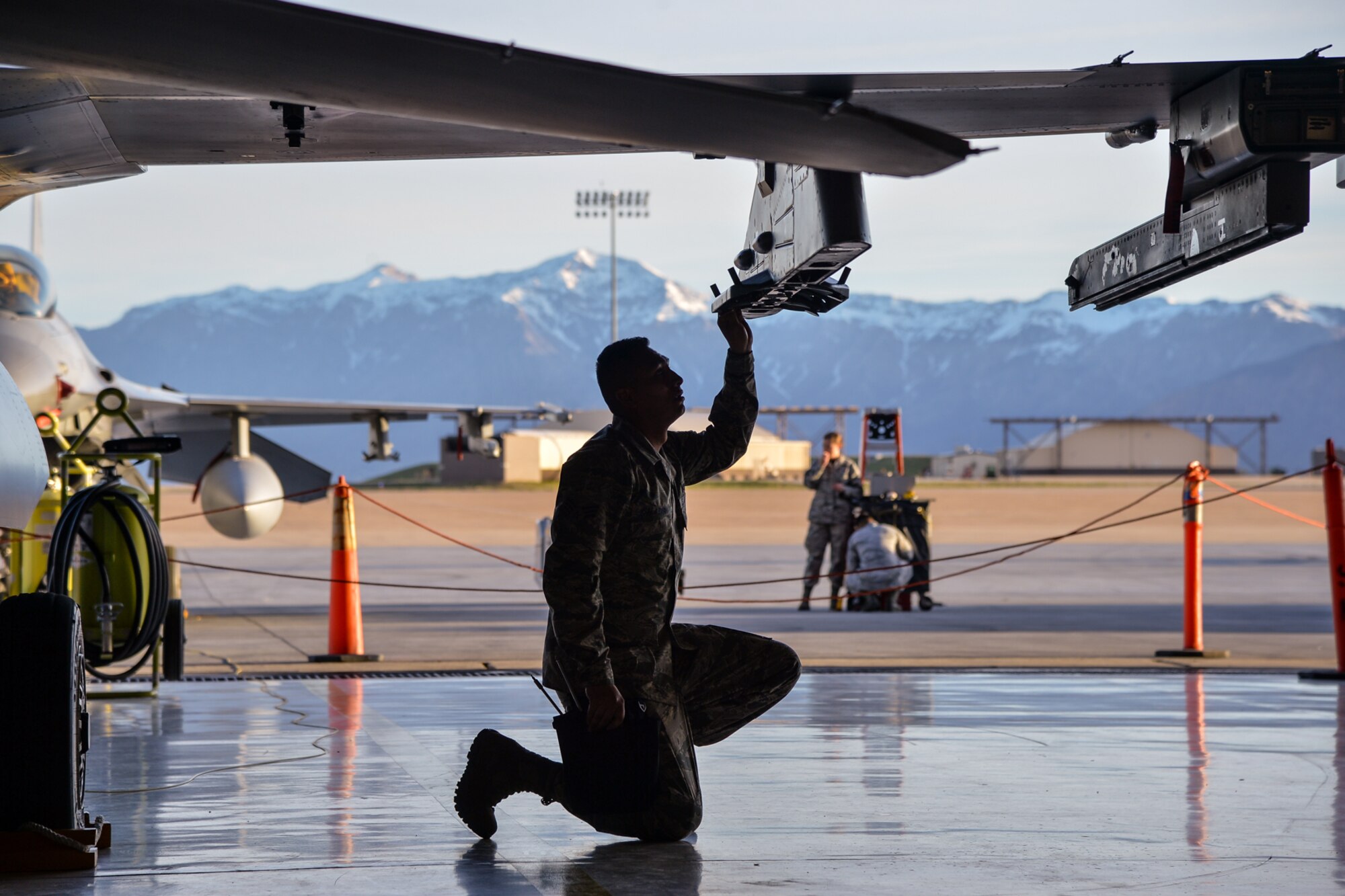 Senior Airman Zackary Salazar, 421st Aircraft Maintenance Unit, prepares an MAU-12 bomb rack on an F-16 aircraft April 8 at Hill Air Force Base, Utah. Salazar and two other Airmen from the 421st AMU competed in the 388th Fighter Wing’s quarterly weapons load competition. (U.S. Air Force photo by R. Nial Bradshaw)