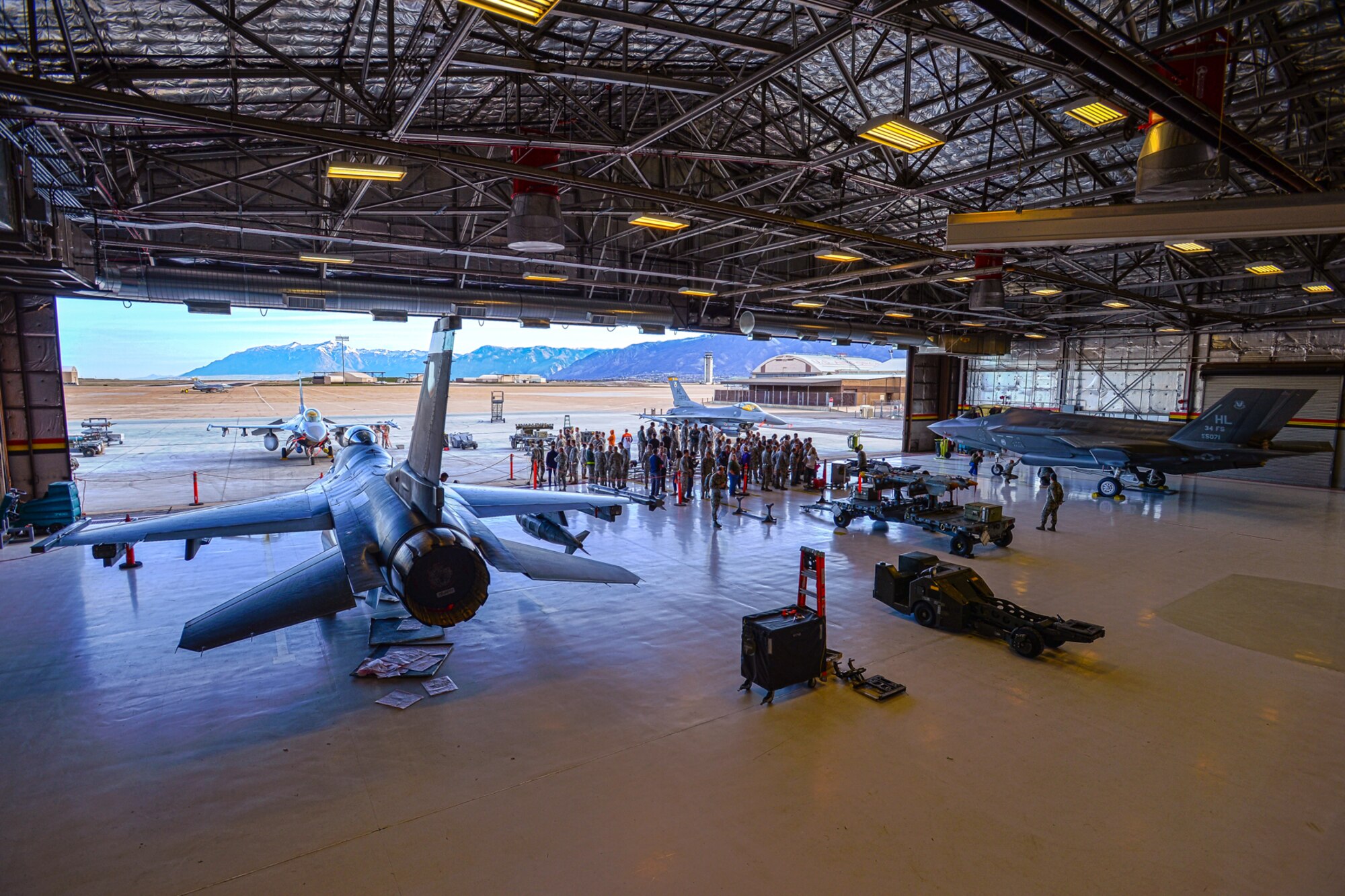 Load crews from the 4th, 421st, 34th and 466th Aircraft Maintenance Units compete in the 388th Fighter Wing’s quarterly weapons load competition April 8 at Hill Air Force Base, Utah. (U.S. Air Force photo)