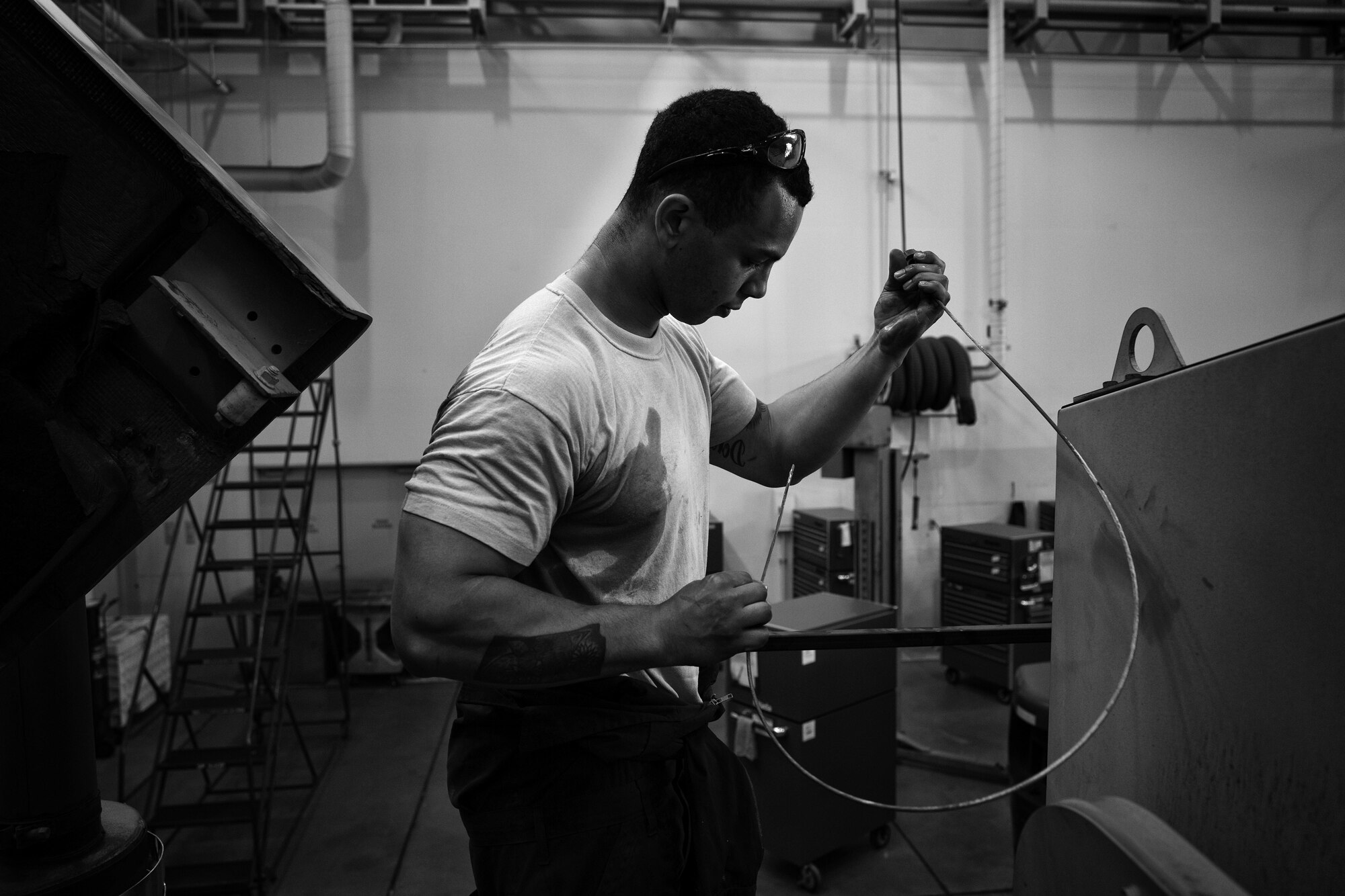 Senior Airman Stephen Royer, 374th Logistics Readiness Squadron vehicle maintenance journeyman, wipes his hands after repairing a snow sweeper at Yokota Air Base, Japan, April 13, 2016. During the spring and summer, the vehicle maintenance shop inspects and service the base’s snow equipment to ensure that it’s ready for the next winter. (U.S. Air Force photo by Senior Airman Delano Scott/Released)