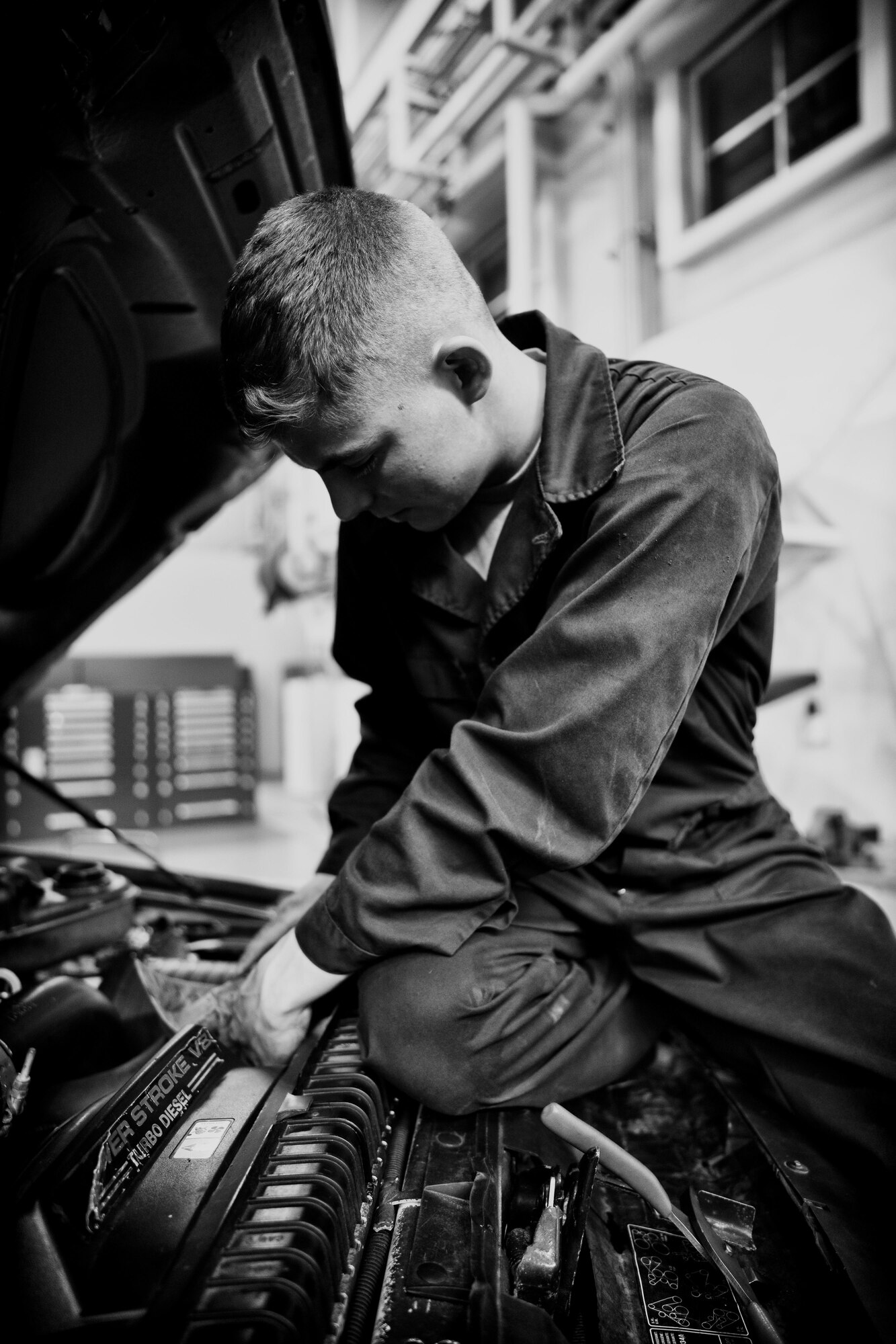 Airman 1st Class Justin Stephens, 374th Logistics Readiness Squadron vehicle maintenance apprentice, works to repair a government vehicle at Yokota Air Base, Japan, April 13, 2016. Roughly 73 percent of all the assets received by the vehicle maintenance shop are back in the customers’ hands within 24 hours. (U.S. Air Force photo by Senior Airman Delano Scott/Released)
