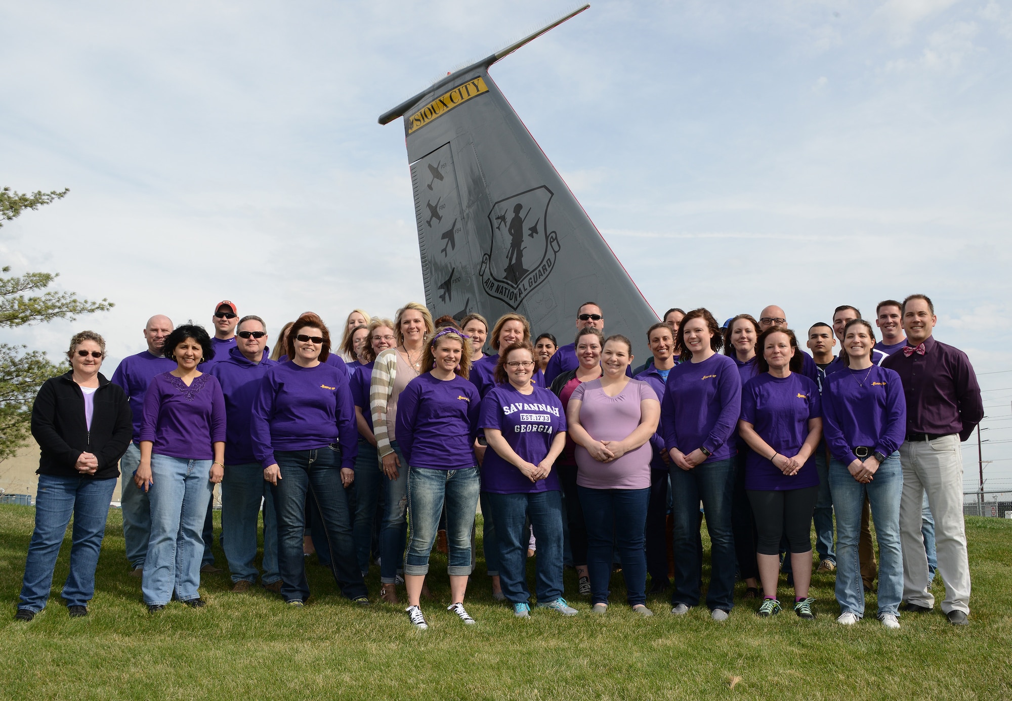Members of the 185th Air Refueling Wing, Iowa Air National Guard, pose for a group photo wearing purple in a show of support for military kids as part of national “Purple up Day” at the Air National Guard base in Sioux City, Iowa on April 15, 2016. 
(Iowa Air National Guard Photo by: Master Sgt. Vincent De Groot/Released)