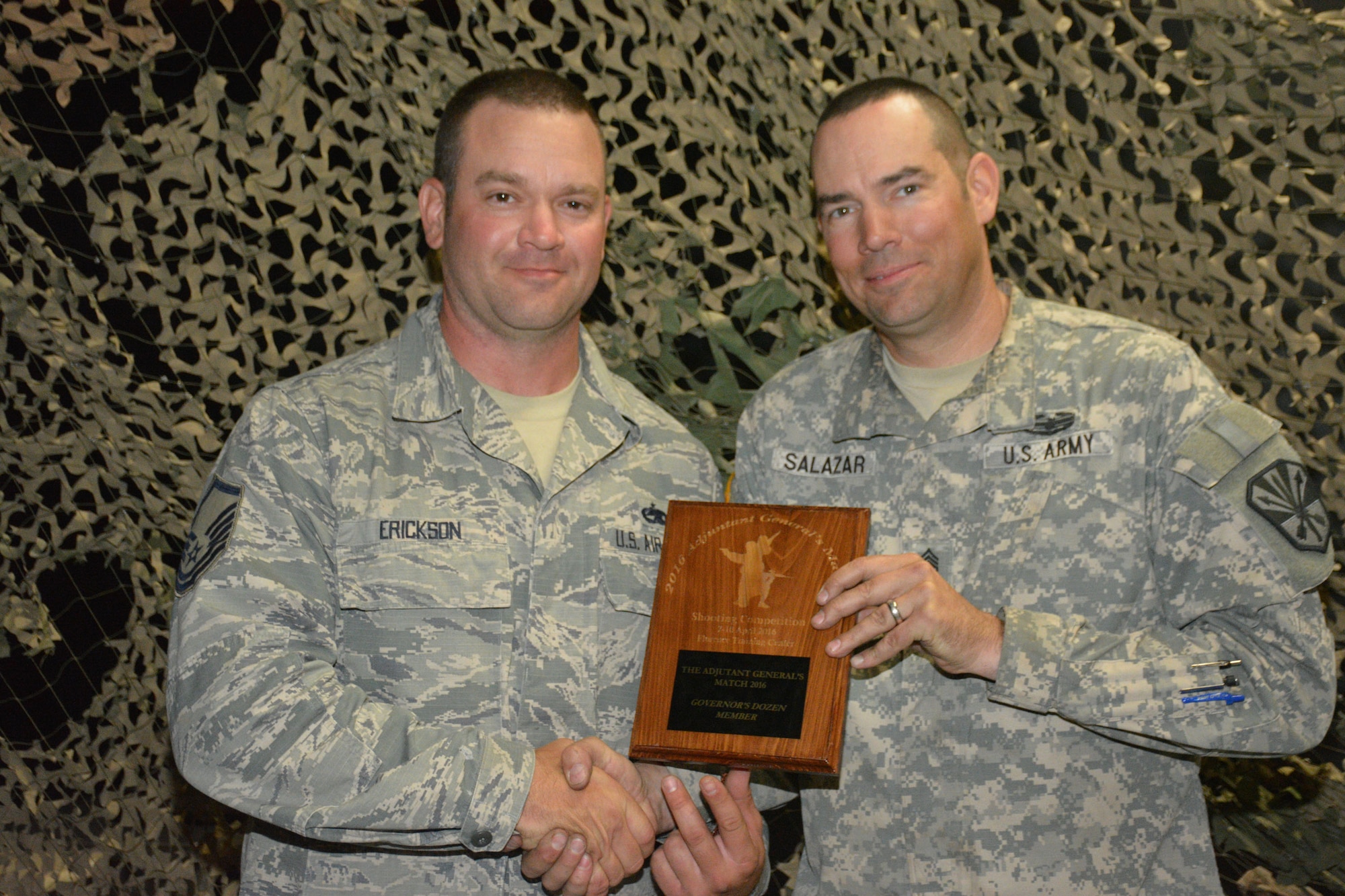 Master Sgt. Scott Erickson of the 161st Air Refueling Wing and Command Sgt. Maj. John Salazar of the Arizona Army National Guard’s Recruiting and Retention Battalion, were recognized as the top marksmen during 2016’s The Adjutant General’s Match. Hosted by the Arizona Army National Guard’s Small Arms Training Branch at the Florence Military Reservation, this four-day, eight event shooting competition featured 67 Guardsmen from the Arizona Army and Air National Guard. The top 12 shooters were awarded the Governor’s dozen tab and have the opportunity to compete at the regional and national levels. (U.S. Army National Guard photo by Sgt. 1st Class Monette Wesolek)