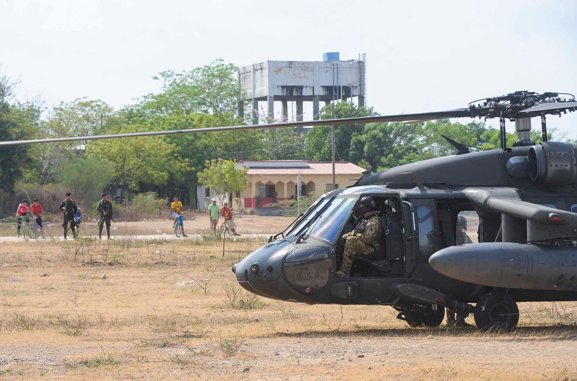 The crew of a UH-60 Blackhawk assigned to the 1st Battalion, 228th Aviation Regiment, Joint Task Force Bravo at Soto Cano Air Base, Honduras, prepare to conduct refueling operations at a forward-positioned staging base in Honduras, April 14, 2016. The forward area refueling point was set up to refuel Blackhawk aircraft being used in deck landing qualifications over the Caribbean Sea. (U.S. Air Force photo by Staff Sgt. Siuta B. Ika)