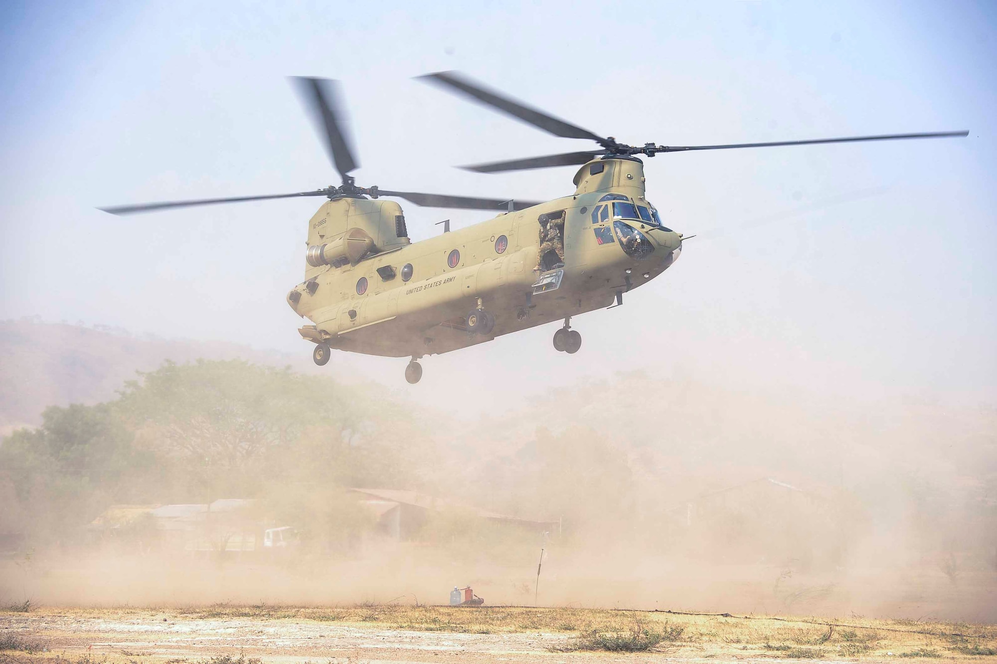 A CH-47 Chinook assigned to the 1st Battalion, 228th Aviation Regiment, Joint Task Force Bravo at Soto Cano Air Base, Honduras, prepares to land at a forward area refueling point in Honduras, April 14, 2016. The Chinook was carrying personnel and supplies to set up and sustain a FARP in an austere operating location in support of deck landing. (U.S. Air Force photo by Staff Sgt. Siuta B. Ika)