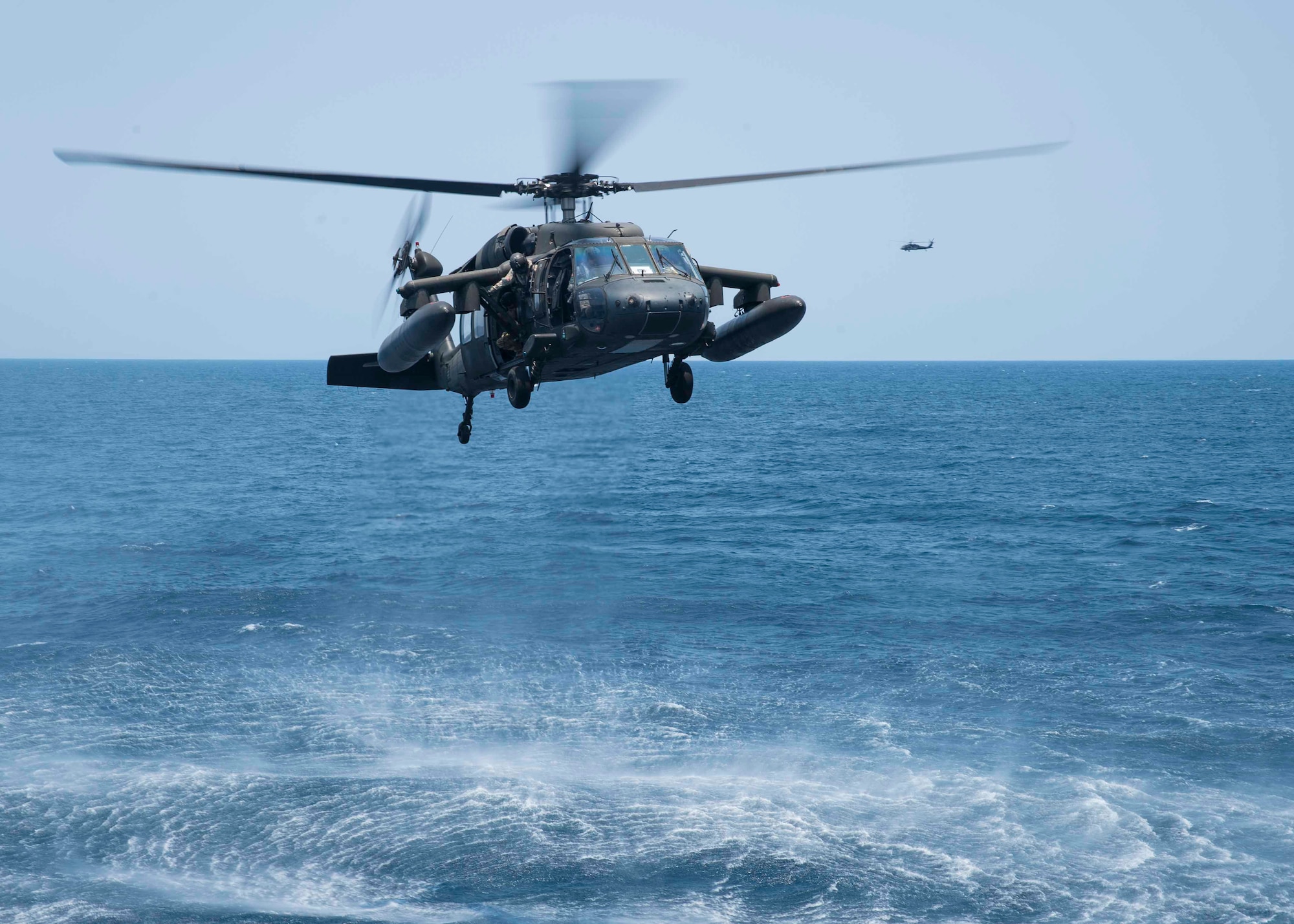 A UH-60 Blackhawk assigned to the 1st Battalion, 228th Aviation Regiment, Joint Task Force Bravo at Soto Cano Air Base, Honduras, approaches the USS Lassen during deck landing qualifications off the coast of Honduras, April 14, 2016. The 1-228 supports U.S. Southern Command's security cooperation strategy by providing heavy lift, medical evacuation and general aviation spanning the area of responsibility. (U.S. Air Force photo by Staff Sgt. Siuta B. Ika)