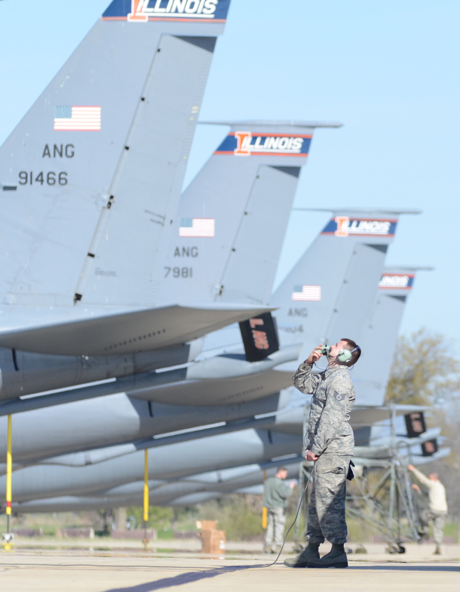 Staff Sgt. Cody Harpster of the 126th Aircraft Maintenance Squadron observes the tail of a KC-135R Stratotanker as the aircrew onboard the aircraft perform pre-flight checklists before a morning flight March 29, 2016 at Scott Air Force Base, Illinois.