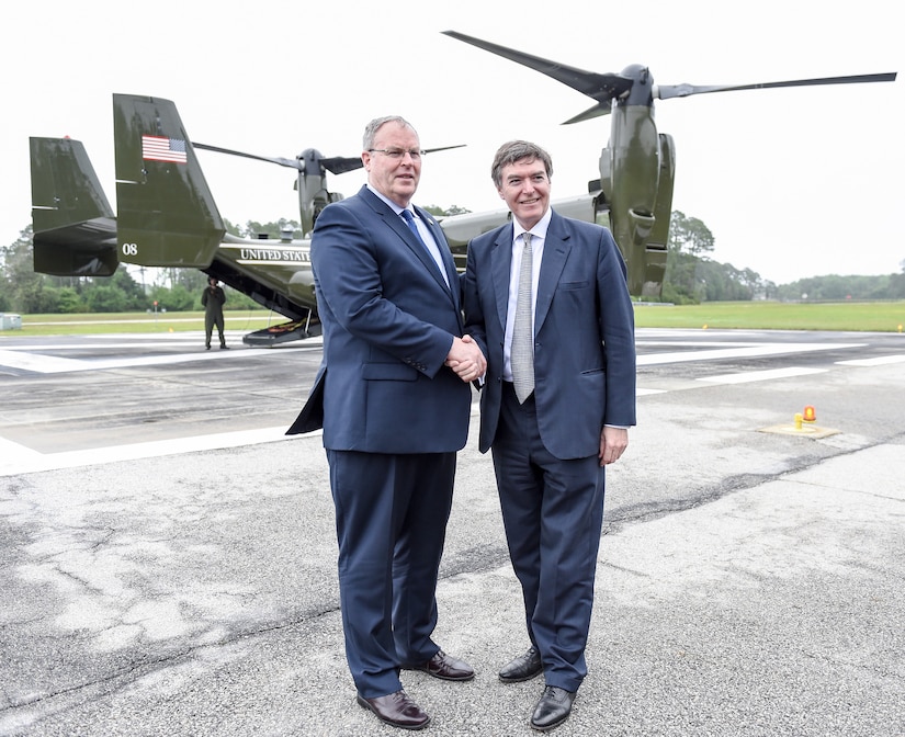 U.S. Deputy Defense Secretary Bob Work and U.K. Defense Procurement Minister Philip Dunne greet at Naval Submarine Base Kings Bay, Ga., en route to Naval Air Station Jacksonville, Fla., April 15, 2016. The defense leaders spent two days visiting military installations in the southeastern United States. DoD photo by Army Sgt. 1st Class Clydell Kinchen
