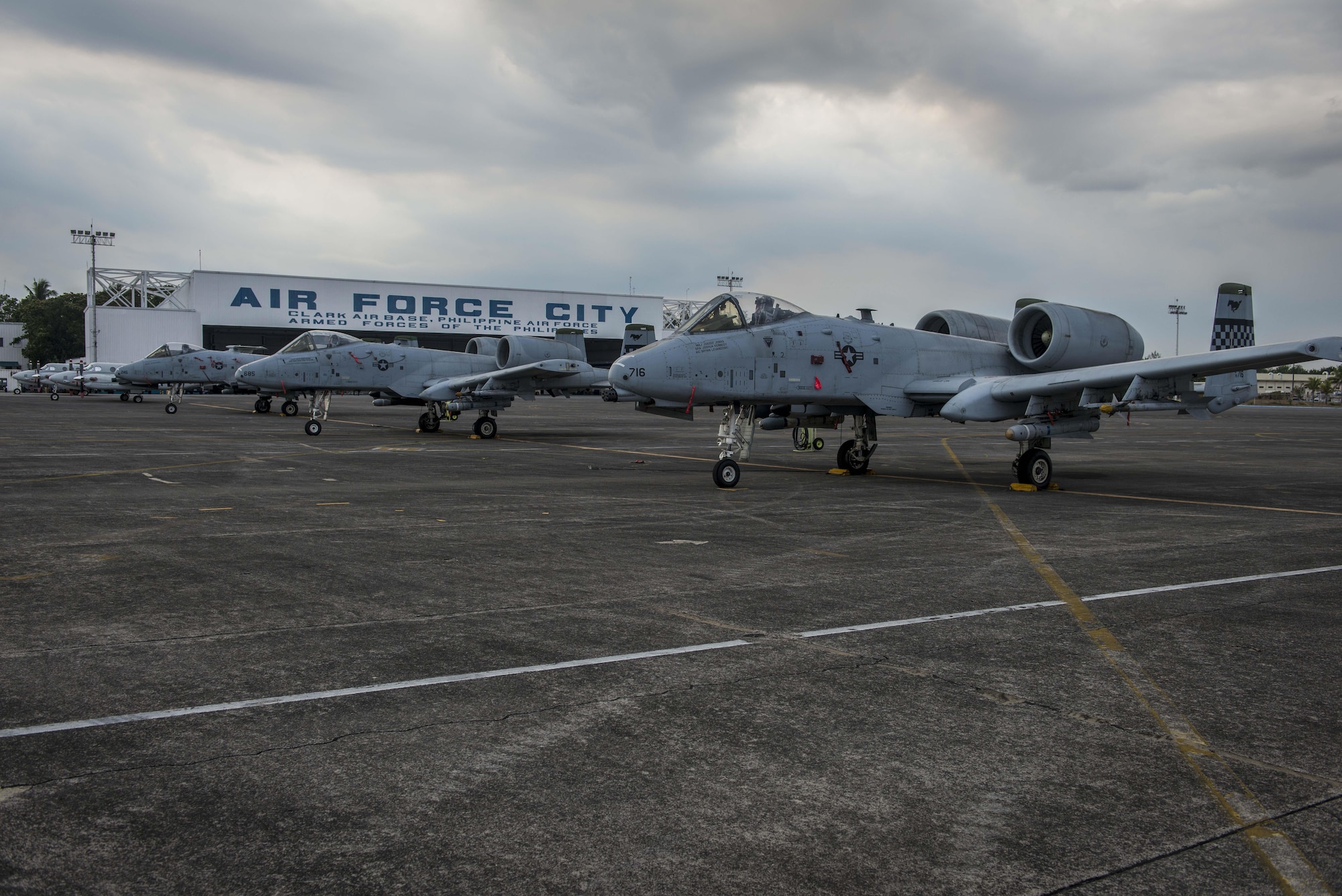 Three of five U.S. Air Force A-10C Thunderbolt IIs, with the 51st Fighter Wing, Osan Air Base, Republic of Korea, sit on the flight line of Clark Air Base, Philippines, April 16, 2016, after having flown missions in support of Exercise Balikatan 16. The A-10Cs are part of a newly stood up Air Contingent in the Indo-Asia-Pacific region that provides credible combat forces to the region capable of a variety of mission including force projection, air and maritime domain awareness, personnel recovery, combating piracy, and assuring access to the air and maritime domains in accordance with international law. The A-10Cs were joined by three HH-60G Pavehawks and approximately 200 Pacific Air Forces personnel including aircrew, maintainers, logistics and support personnel. (U.S. Air Force photo by Staff Sgt. Benjamin W. Stratton)
