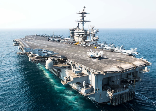 (Oct. 10, 2015) The aircraft carrier USS Theodore Roosevelt (CVN 71) transits the Arabian Gulf. Theodore Roosevelt is deployed in the U.S. 5th Fleet area of operations supporting Operation Inherent Resolve, strike operations in Iraq and Syria as directed, maritime security operations and theater security cooperation efforts in the region.