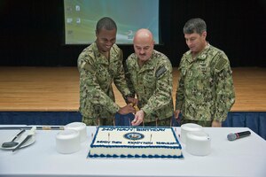 (Oct. 13, 2015) Vice Adm. Kevin Donegan, right, commander of U.S. Naval Force Central Command/U.S. 5th Fleet/Combined Maritime Forces participates in a 240th Navy birthday cake-cutting with Intelligence Specialist 3rd Class Elijah Buford, left, the youngest Sailor and Lt. Cmdr. Christopher Haley, the eldest Sailor at Naval Support Activity, Bahrain. U.S. Naval Force Central Command/Commander, U.S. 5th Fleet is responsible for 2.5 million square miles of area including the Arabian Gulf, Sea of Oman, Gulf of Aden, Red Sea and parts of the Indian Ocean and 20 countries.