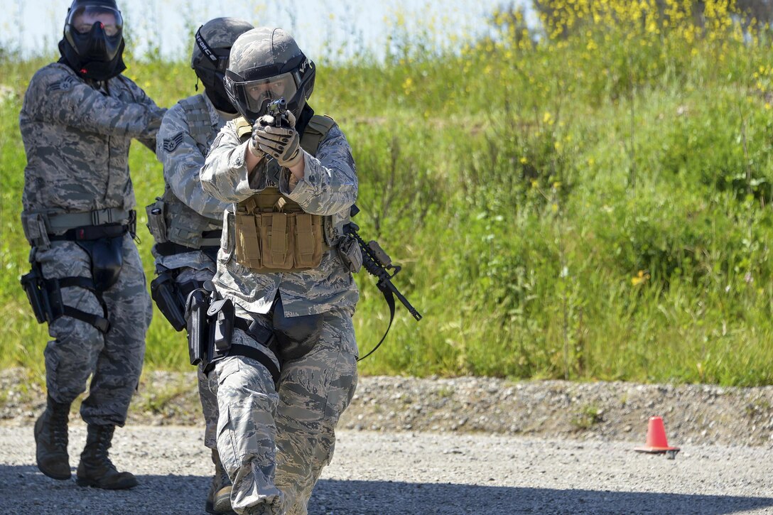 Air Force Tech. Sgt. Brooke Williams serves as the point person on a security team responding to a simulated active shooter at Travis Air Force Base, Calif., April 13, 2016. Williams provides close-in security for Air Mobility Command aircraft moving on airfields where security is unknown or additional security is needed. Air Force photo by Staff Sgt. Charles Rivezzo