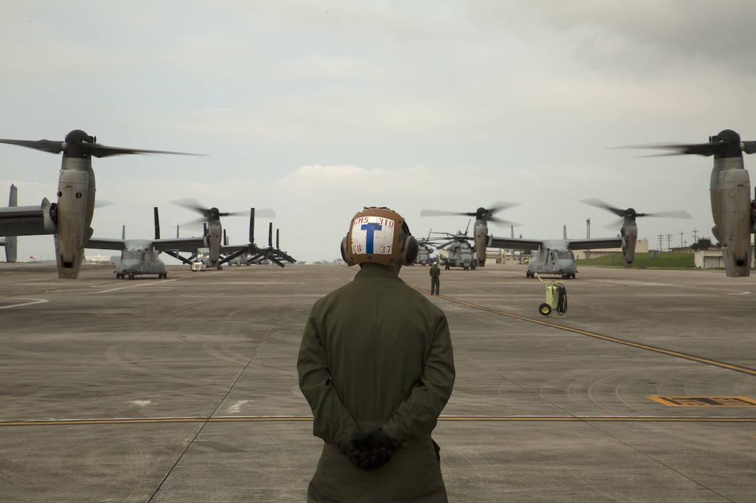 A Marine waits to guide MV-22 Ospreys with Marine Medium Tiltrotor Squadron 265, 31st Marine Expeditionary Unit, during their takeoff April 17 on Marine Corps Air Station Futenma. United States Forces, Japan is providing operational airlift support in coordination with the Government of Japan’s efforts to provide relief following the devastating earthquake near Kumamoto. “We express our deepest condolences to all of those affected by the recent earthquakes in Kyushu,” said Lt. Gen. John Dolan, commander of USFJ. “To the people of Japan and the region affected by this tragedy we send our heartfelt sympathies. The men and women of U.S. Forces, Japan stand with you during this difficult time.” The long-standing alliance between Japan and the U.S. allows U.S. military forces in Japan to provide rapid, integrated support to the Japanese Self-Defense Forces and civil relief efforts.
