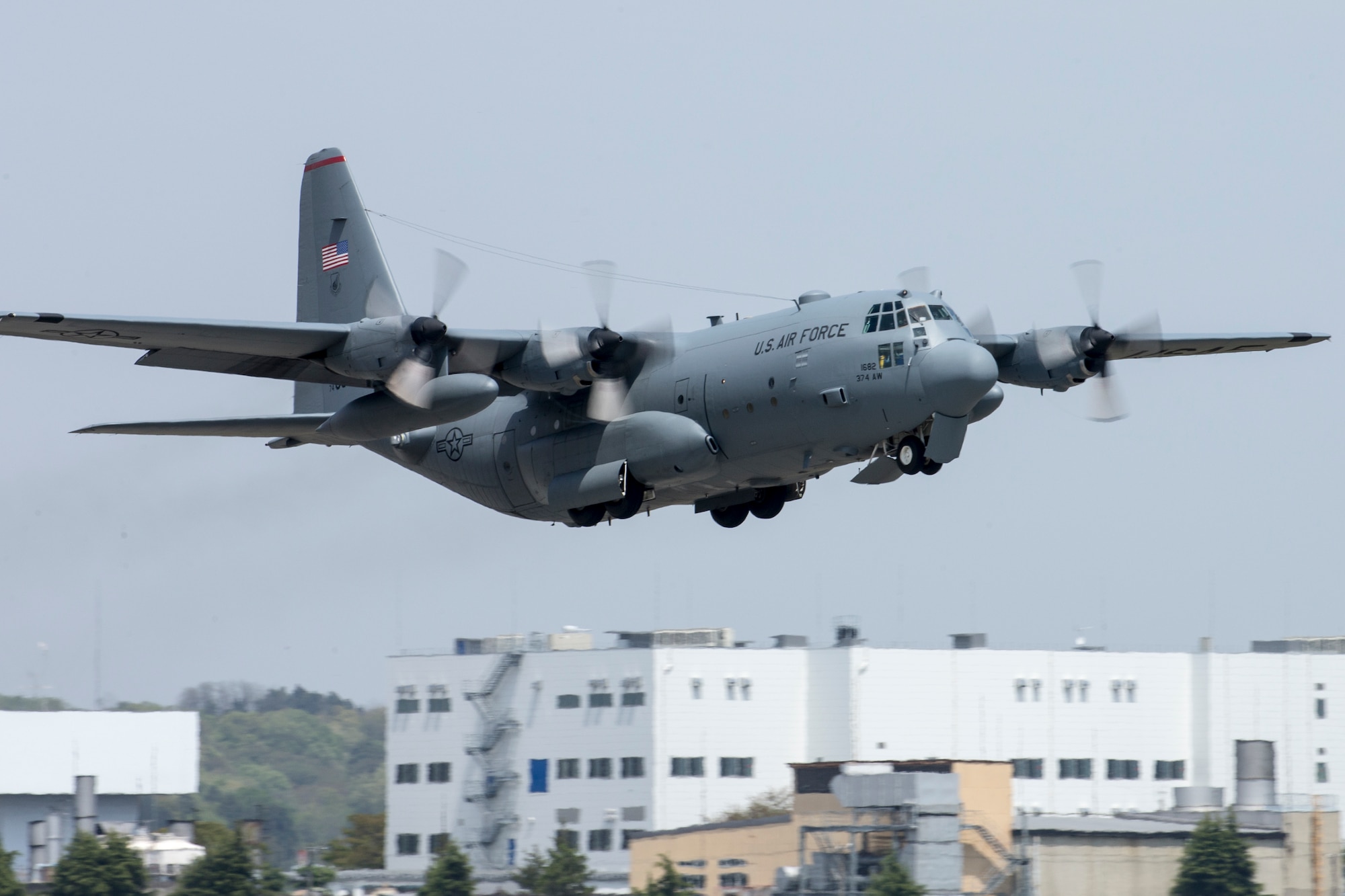 A C-130 Hercules takes off from Yokota Air Base, Japan, April 18, 2016. The 374th Airlift Wing sent two aircraft in support of the Government of Japan in their relief efforts for the series of earthquakes that took place in the Kyushu region recently. The aircraft transported heavy vehicles and personnel from Chitose Air Base, Hokkaido to Kyushu. (U.S. Air Force photo by Yasuo Osakabe/Released)