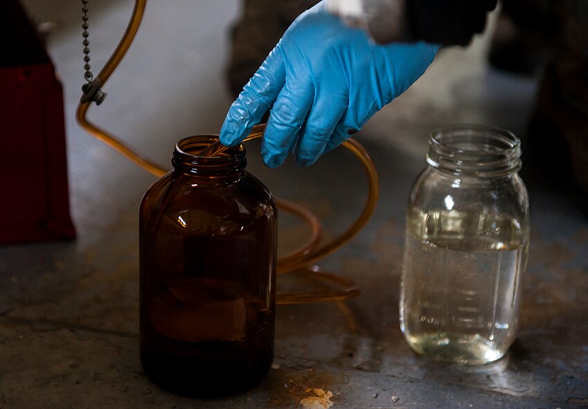 U.S. Air Force Senior Airman Michael Debolt, 18th Logistics Readiness Squadron fuels distribution operator, takes samples of JP-8 fuel April 13, 2016, at Kadena Air Base, Japan. Fuels Airmen provide a vital service in getting warfighting aircraft clean, reliable fuel at a moment’s notice. (U.S. Air Force photo by Airman 1st Class Corey M. Pettis)