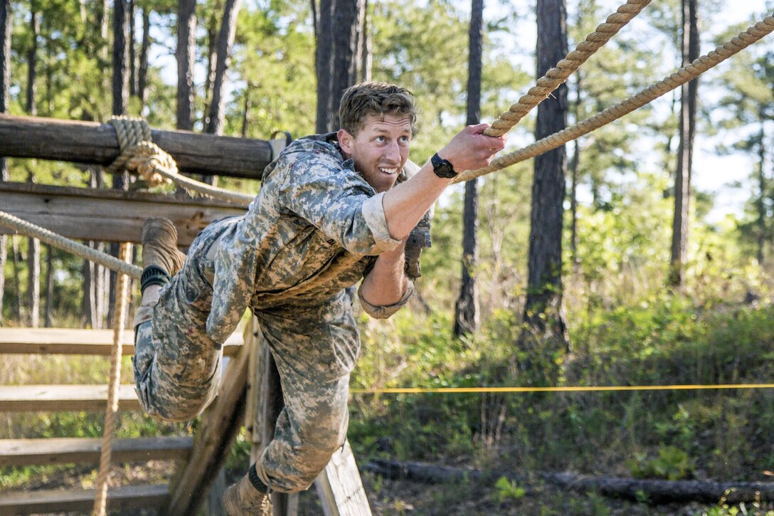 Army 1st Lt. Anthony Day navigates a rope obstacle during the Best Ranger Competition 2016 at Fort Benning, Ga., April 17, 2016. The three-day competition comprised challenges testing competitors' physical, mental and technical capabilities. Army photo by Spc. Tracy McKithern