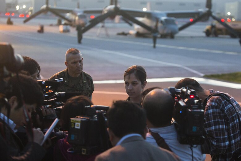 Japanese media interview Capt. Tessa Snow, an MV-22B Osprey pilot with Marine Medium Tiltrotor Squadron (VMM) 265 attached to the 31st Marine Expeditionary Unit at Marine Corps Air Station Iwakuni, Japan, in support of the Government of Japan’s relief efforts following yesterday’s devastating earthquake near Kumamoto April 17, 2016. The long-standing relationship between Japan and the U.S. allows U.S. military forces in Japan to provide rapid, integrated support to the Japan Self-Defense Forces and civil relief efforts. (U.S. Marine Corps photo by Lance Cpl. Jacob A. Farbo/Released)