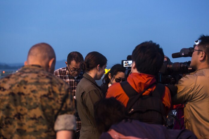 Japanese media interview Capt. Tessa Snow, an MV-22B Osprey pilot with Marine Medium Tiltrotor Squadron (VMM) 265 attached to the 31st Marine Expeditionary Unit at Marine Corps Air Station Iwakuni, Japan, in support of the Government of Japan’s relief efforts following yesterday’s devastating earthquake near Kumamoto April 17, 2016. The long-standing relationship between Japan and the U.S. allows U.S. military forces in Japan to provide rapid, integrated support to the Japan Self-Defense Forces and civil relief efforts. (U.S. Marine Corps photo by Lance Cpl. Jacob A. Farbo/Released)