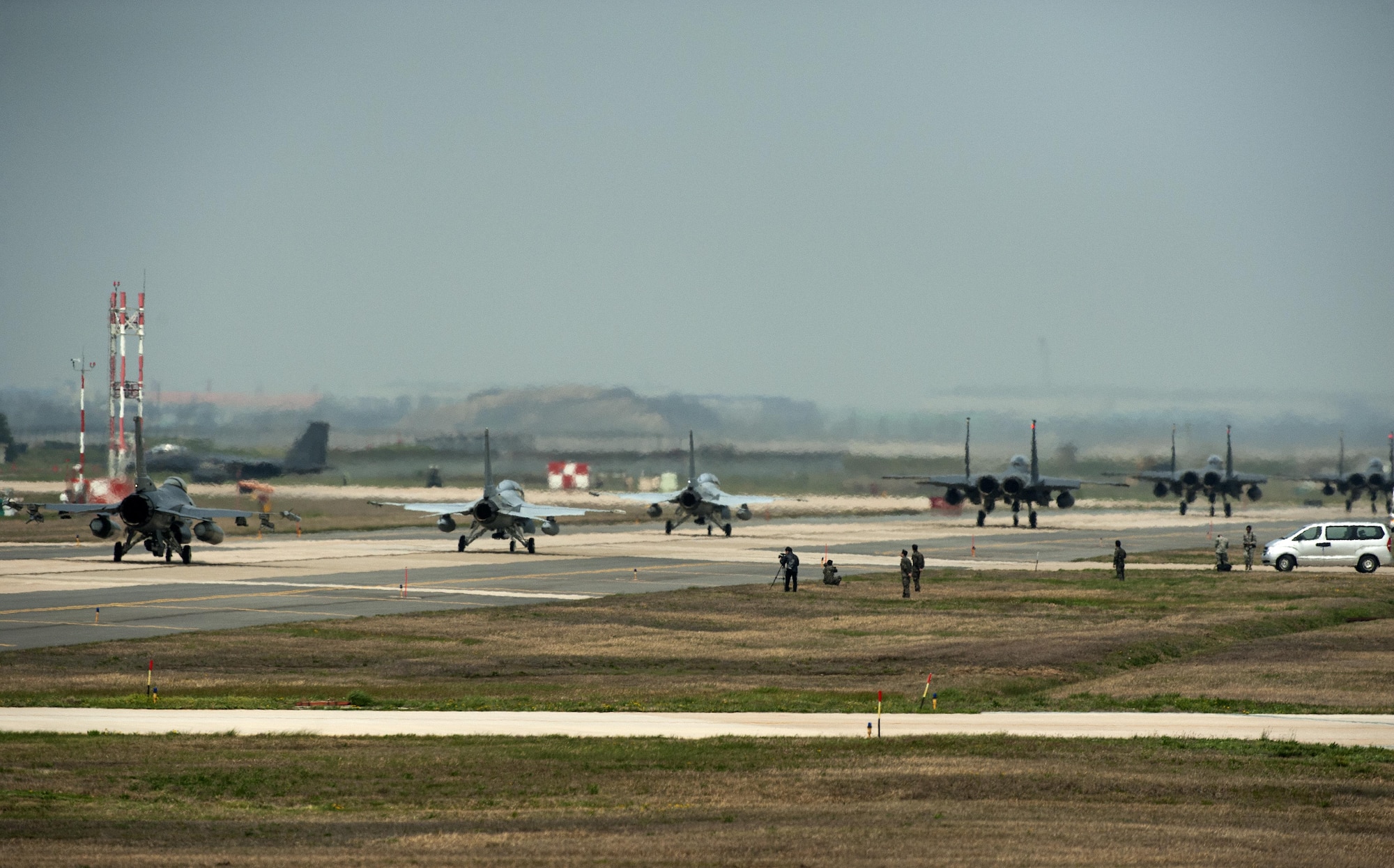 Aircraft from the 8th Fighter Wing, 19th Fighter Wing, Jungwon Air Base, Republic of Korea, and the 11th Fighter Wing, Daegu Air Base, ROK, taxi towards the runway during Max Thunder 16 at Kunsan Air Base, Republic of Korea, April 18, 2016. Exercise Max Thunder is part of a continuous exercise program to enhance interoperability between U.S. and ROK forces. (U.S. Air Force photo by Staff Sgt. Nick Wilson/Released)