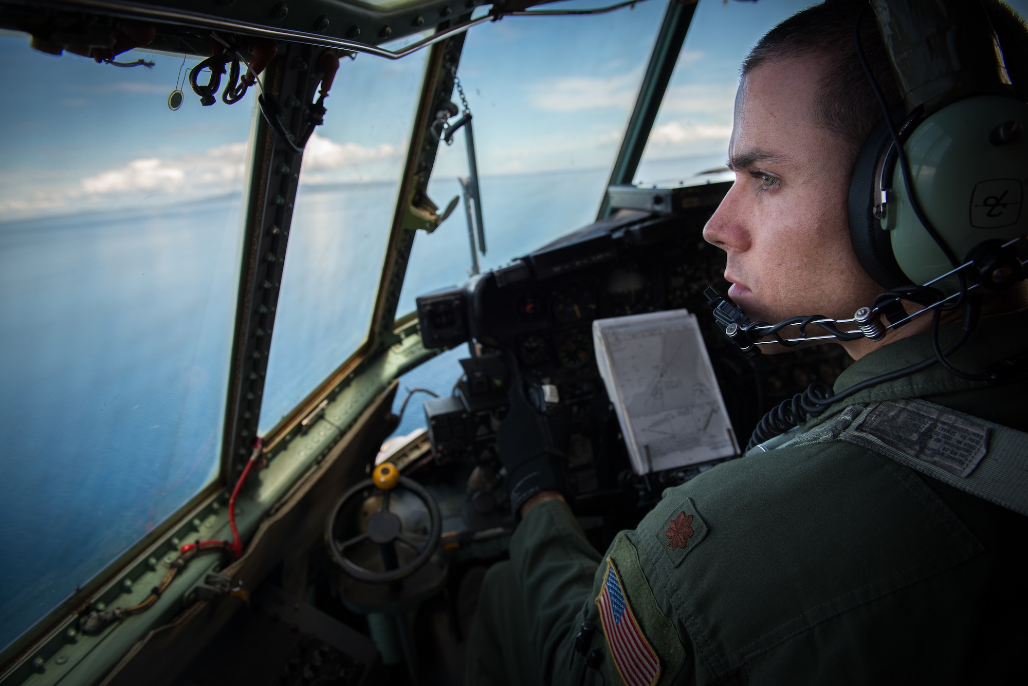 U.S. Air Force Maj. Matthieu Rigollet, 36th Airlift Squadron C-130 Hercules pilot, flies off the coast of Mactan, Philippines as a part of Exercise Balikatan, April 14, 2016. The flight was a part of Exercise Balikatan, an annual Phillippines- U.S. alliance focused on a variety of missions, including humanitarian assistance, maritime law enforcement, and environmental protection. (U.S. Air Force photo by Staff Sgt. Michael Smith/ Released)