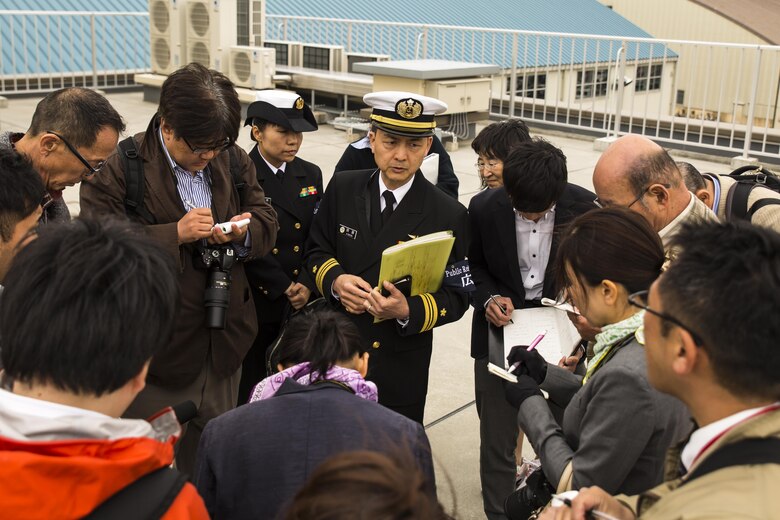Japanese media interview Japan Maritime Self-Defense Force Lt. Cmdr. Kiyosui Saitoh, public relations officer with Fleet Air Wing 31, at Marine Corps Air Station Iwakuni, Japan, in support of the Government of Japan’s relief efforts following the devastating earthquake near Kumamoto April 18, 2016. The long-standing relationship between Japan and the U.S. allows U.S. military forces in Japan to provide rapid, integrated support to the Japan Self-Defense Forces and civil relief efforts. (U.S. Marine Corps photo by Lance Cpl. Aaron Henson/Released)