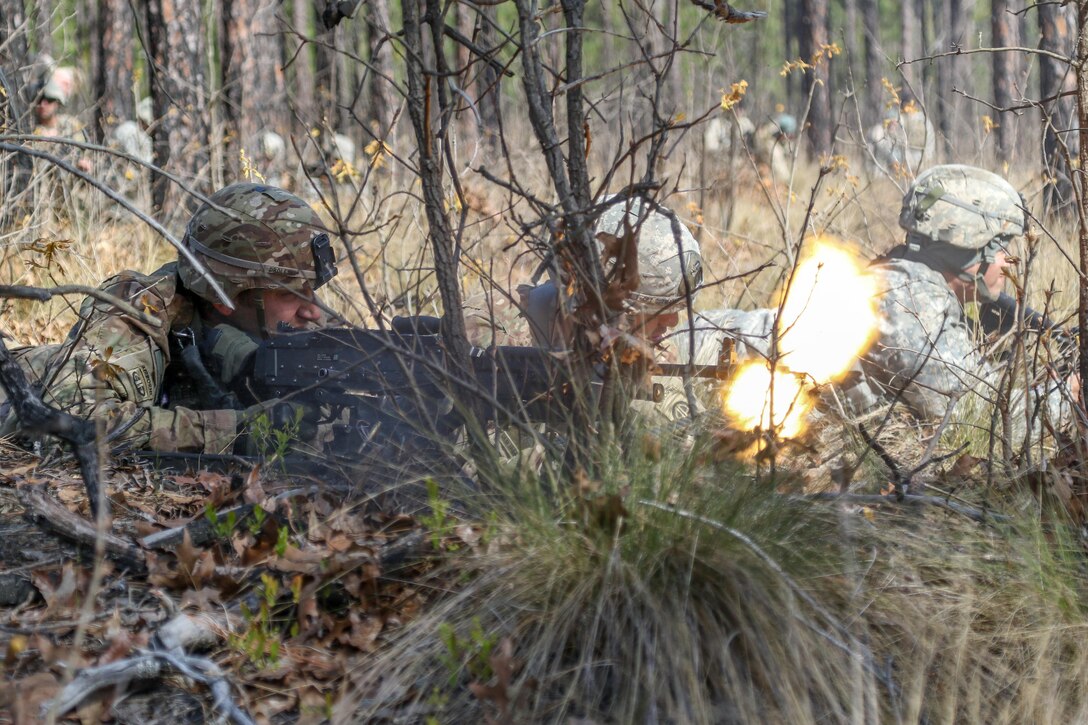 Army Warrant Officer Casimir A. Droleski fires an M240B machine gun during an ambush operation part of the Mungadai training mission at Fort Bragg, N.C., April 6, 2016. A "Mungadai" is name derived from a test once used hundreds of years ago by Genghis Khan for his Mongolian empire's army. Droleski is a paratrooper assigned to the 82nd Airborne Division's 2nd Brigade Combat Team. Army photo by Staff Sgt. Jason Hull