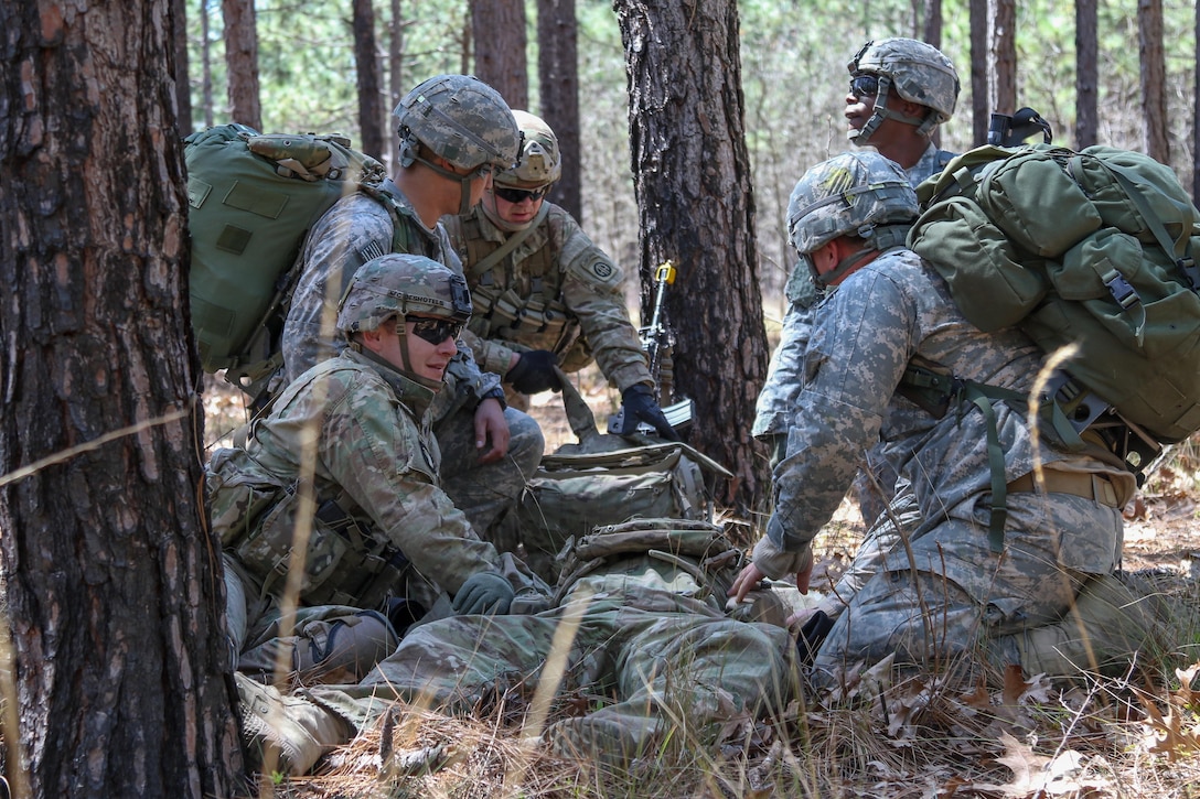 Paratroopers provide medical aid to a notional casualty during Mungadai training mission at Fort Bragg, N.C., April 6, 2016. A "Mungadai" is name derived from a test once used hundreds of years ago by Genghis Khan for his Mongolian empire's army. Army photo by Staff Sgt. Jason Hull