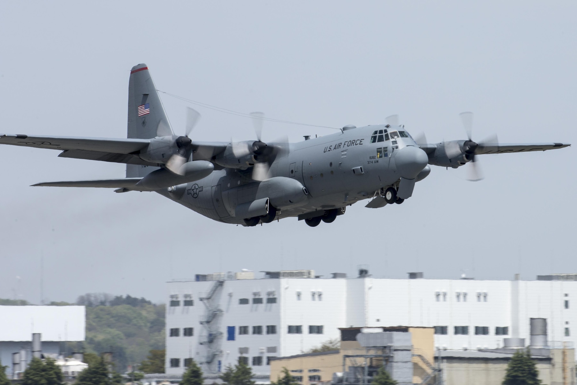 A C-130 Hercules takes off from Yokota Air Base, Japan, April 18, 2016. The 374th Airlift Wing sent two aircraft in support of the government of Japan in their relief efforts for the series of earthquakes that took place in the Kyushu region recently. The aircraft transported heavy vehicles and personnel from Chitose Air Base, Hokkaido to Kyushu. (U.S. Air Force photo/Yasuo Osakabe)