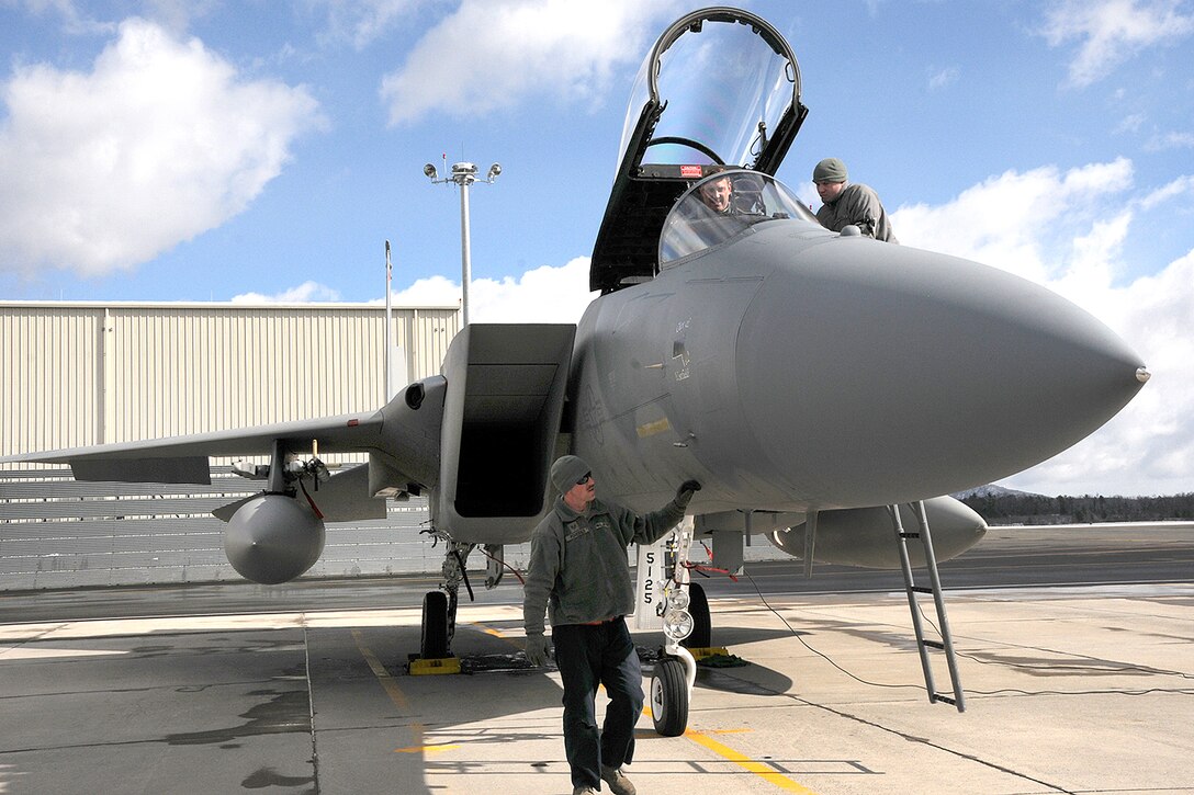 Airmen finalize prefight checks for F-15 Eagle aircraft before takeoff at Barnes Air National Guard Base, Mass., April 3, 2016. Air National Guard photo by Senior Airman Loni Kingston