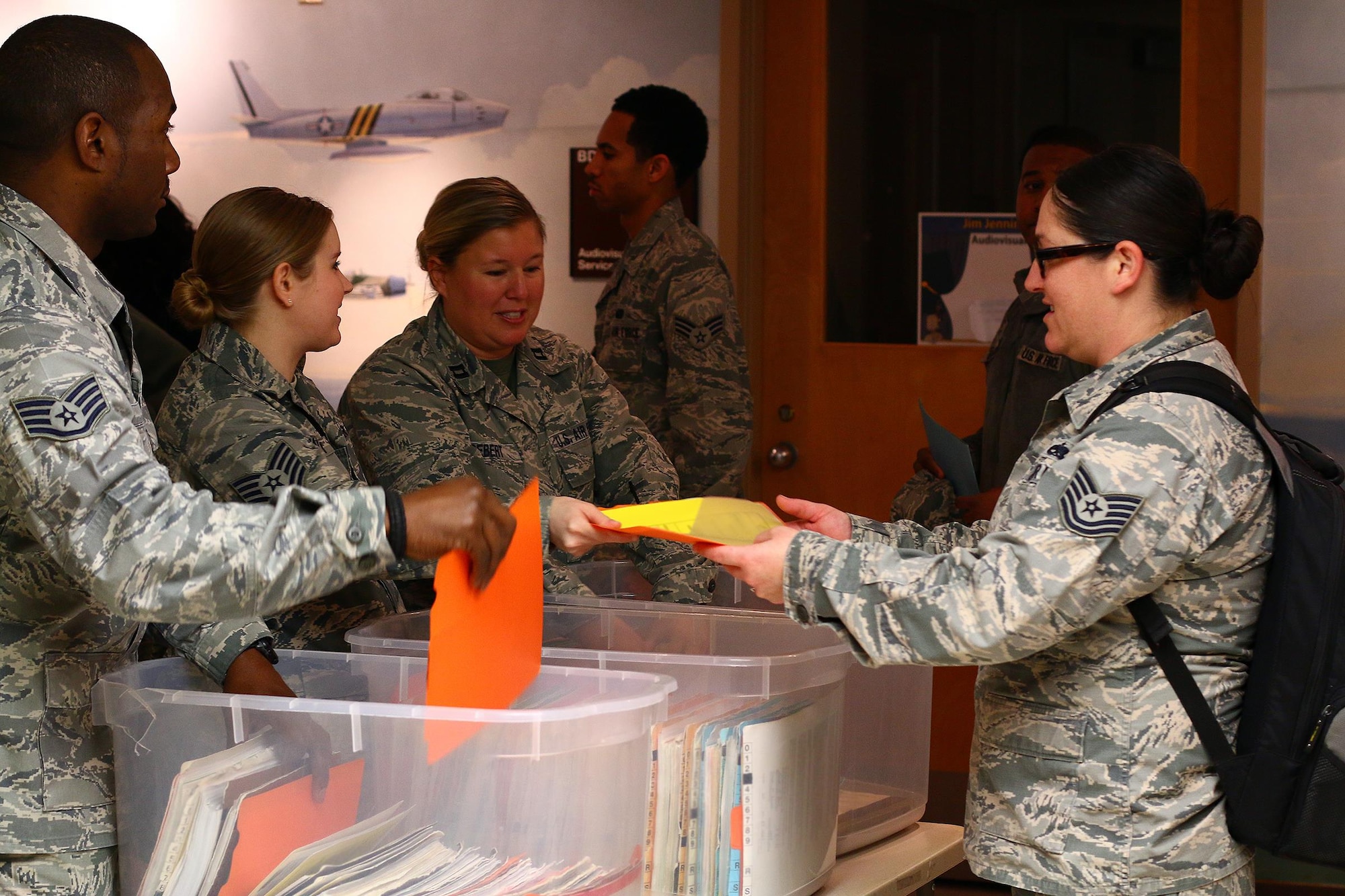 Members of the 445th Aerospace Medicine Squadron distribute medical records to wing personnel as part of the annual physical health assessment March 5, 2016, at the Wright-Patterson Air Force Base Medical Center.