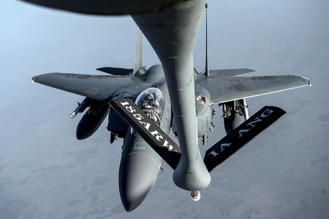 An Air Force F-15 Strike Eagle approaches a KC-135 Stratotanker aircraft to refuel over Iraq in support of Operation Inherent Resolve, April 6, 2016. Air Force photo by Tech. Sgt. Nathan Lipscomb 