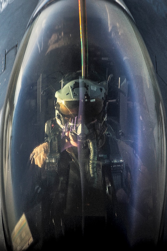 An Air Force F-16 Fighting Falcon pilot receives fuel from a KC-135 Stratotanker over Iraq in support of Operation Inherent Resolve, April 6, 2016. Air Force photo by Tech. Sgt. Nathan