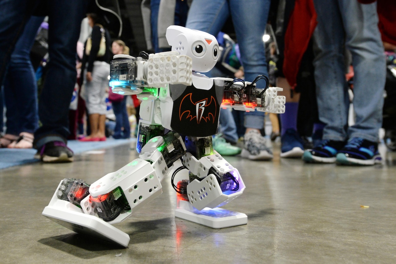 A robot programmed by U.S. Naval Academy midshipmen performs for students visiting the USA Science and Engineering Festival in Washington, D.C., April 15, 2016. DoD photo by EJ Hersom