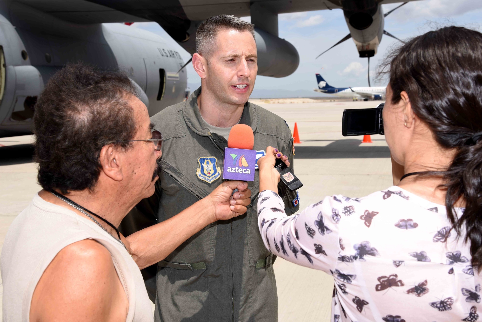 Capt. Jordan Mentzer, 53rd Weather Reconnaissance Squadron “Hurricane Hunter” pilot, speaks with local media in Cabo San Lucas, Mexico, about the mission of the Hurricane Hunters during the Caribbean Hurricane Awareness Tour April 11, 2016. The purpose of the CHAT is to raise hurricane awareness across Latin America and the Caribbean, and to maintain and expand partnerships among the National Hurricane Center, U.S. Northern Command, the U.S. Air Force and our neighbors in the region. (U.S. Air Force photo by Tech. Sgt. Ryan Labadens)