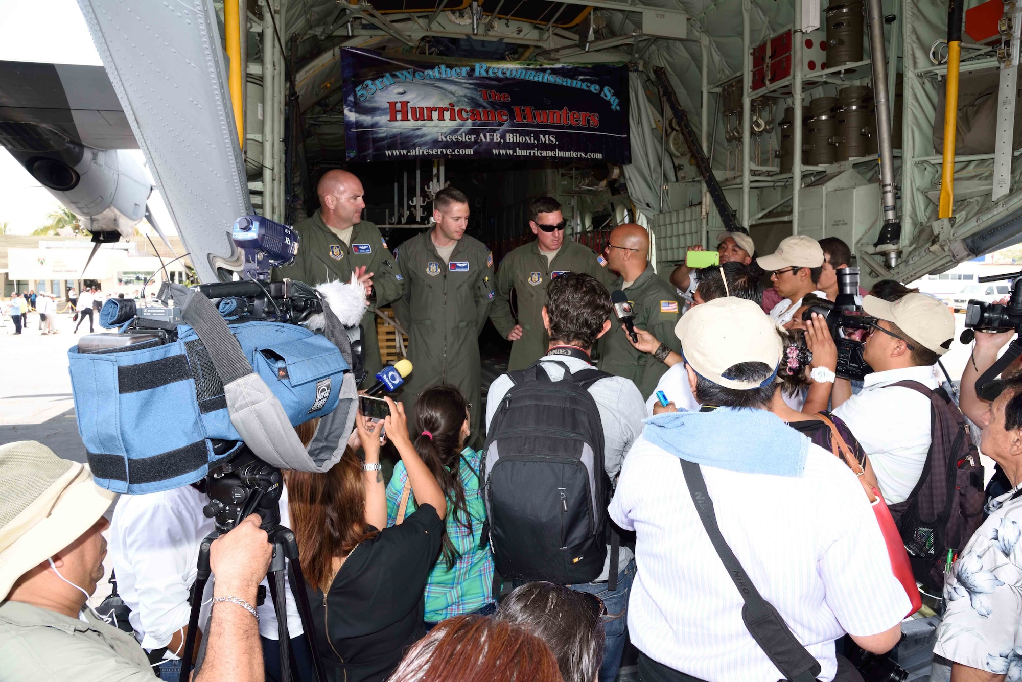 53rd Weather Reconnaissance Squadron “Hurricane Hunter” aircrew members answer questions from local media in Puerto Vallarta, Mexico, about the mission of the Hurricane Hunters during the Caribbean Hurricane Awareness Tour April 12, 2016. The purpose of the CHAT is to raise hurricane awareness across Latin America and the Caribbean, and to maintain and expand partnerships among the National Hurricane Center, U.S. Northern Command, the U.S. Air Force and our neighbors in the region. (U.S. Air Force photo/Tech. Sgt. Ryan Labadens)