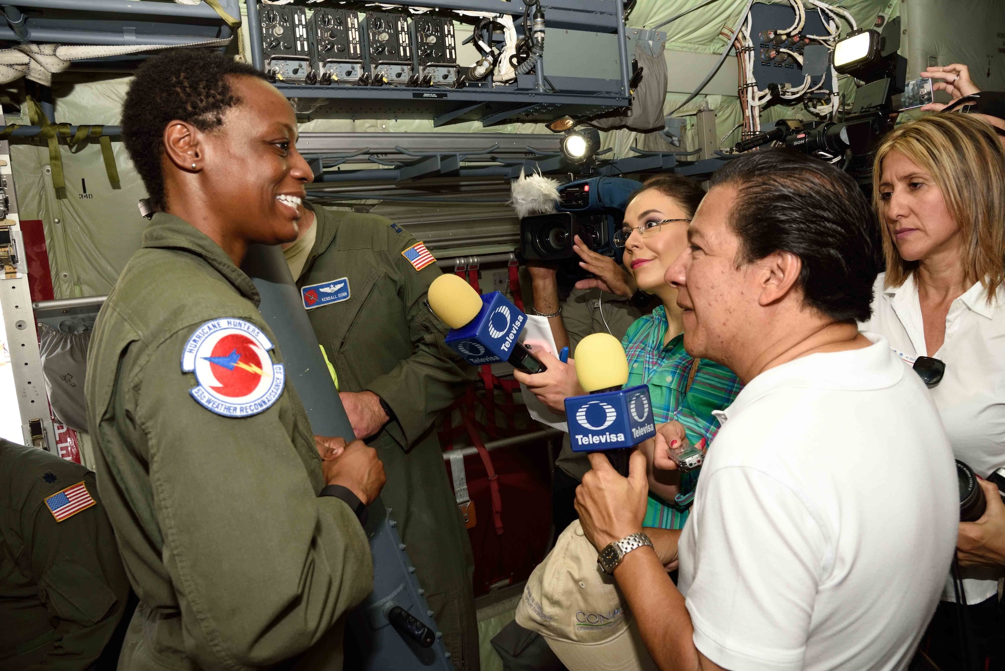 Tech. Sgt. Karen Moore, 53rd Weather Reconnaissance Squadron “Hurricane Hunter” weather reconnaissance loadmaster, addresses questions from local media in Puerto Vallarta, Mexico, about the mission of the Hurricane Hunters during the Caribbean Hurricane Awareness Tour April 12, 2016. The purpose of the CHAT is to raise hurricane awareness across Latin America and the Caribbean, and to maintain and expand partnerships among the National Hurricane Center, U.S. Northern Command, U.S. Air Force and neighbors in the region. (U.S. Air Force photo/Tech. Sgt. Ryan Labadens)