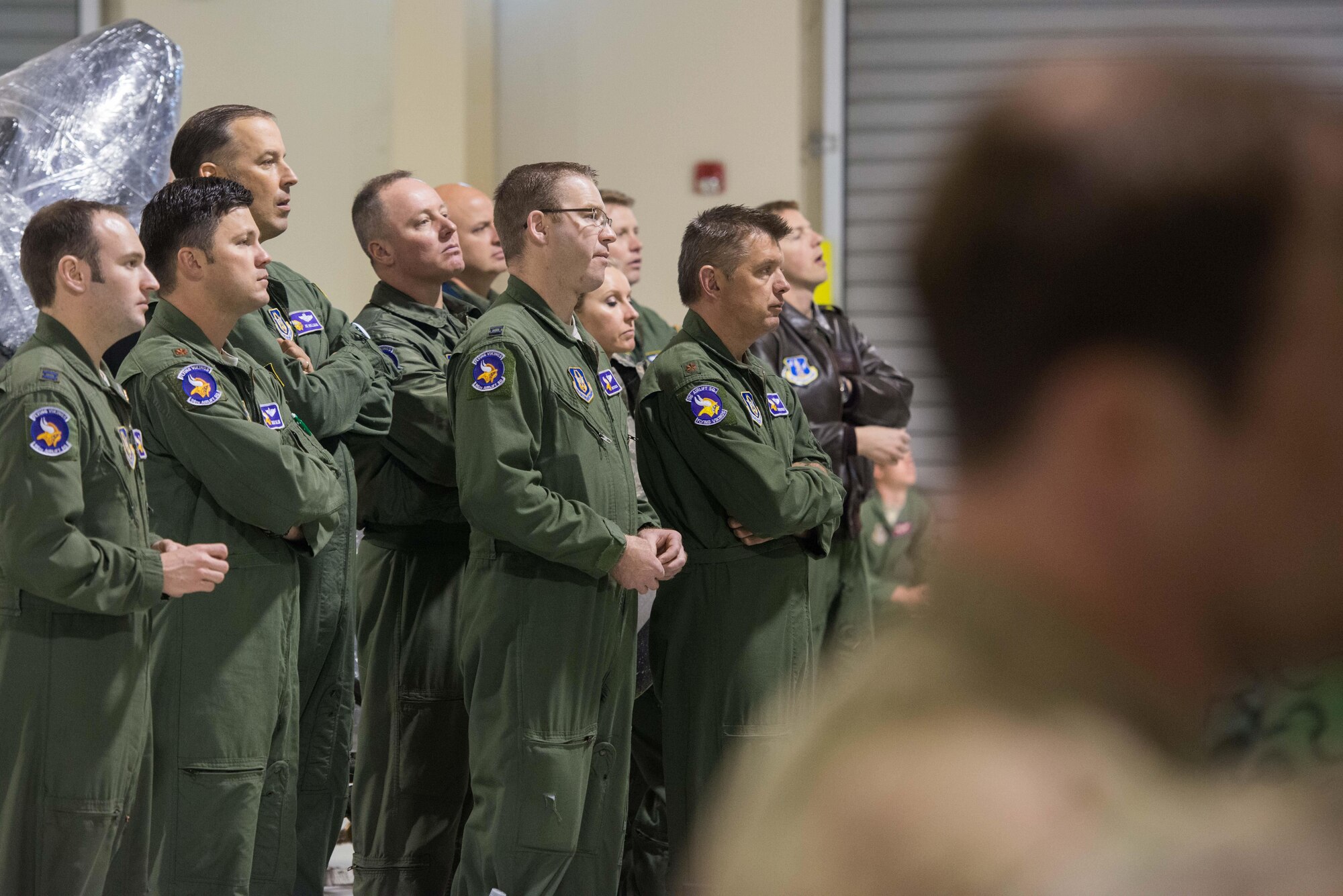 Flight crews from the 934th Airlift Wing listen to a joint mission briefing on Exercise Saber Junction at Aviano AB, Italy, April 9. (U.S. Air Force photo by Staff Sgt. Trevor Saylor)