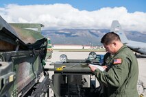 Master Sgt. Dave Montanez, 96th Airlift Squadron loadmaster, reviews a cargo manifest prior to loading cargo onto a C-130 for airdrops in support of Exercise Saber Junction. (U.S. Air Force photo by Staff Sgt. Trevor Saylor)