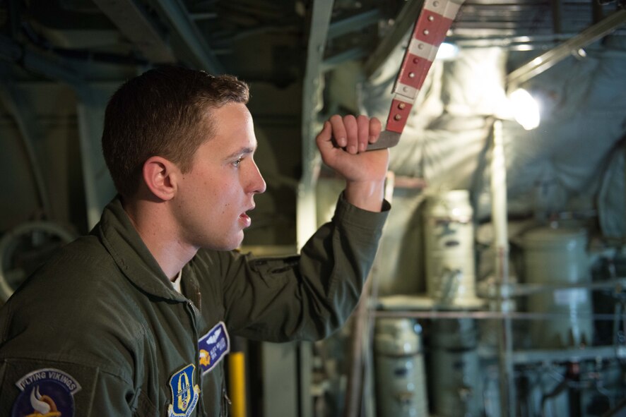 Senior Airman Alec Miller, a loadmaster from the 96th Airlift Squadron, watches as members of the Army's Joint Air Inspection team inspect the contents of a C-130 prior to takeoff at Aviano AB, Italy, in support of Exercise Saber Junction, on April 10. (U.S. Air Force photo by Staff Sgt. Trevor Saylor)