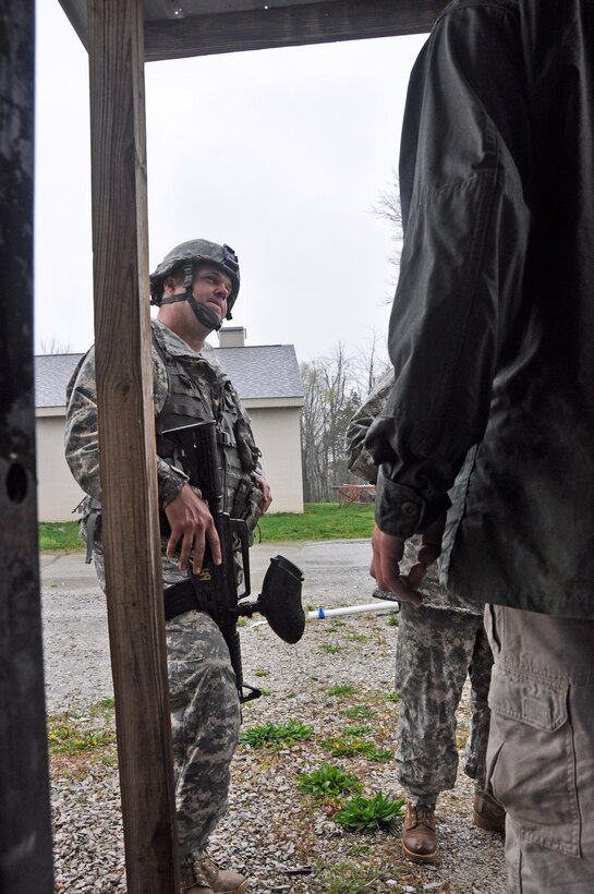 Spec. Steven Whitmore, a Soldier with the Army Reserve’s 346th Psychological Operations Company (Airborne) out of Columbus, Ohio, conducts a routine patrol during training at the Indiana National Guard’s Muscatatuck Urban Training Center on Wednesday, April 13. (photo by 1st Lt. Timothy Wilmetti, Chaplain Candidate, 15th Psychological Operations Battalion)