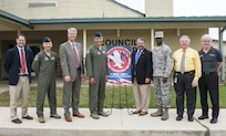 From left to right: Brian James, Schertz executive director of development, Lt. Col. Emil Bliss, 12th Flying Training Wing community initiatives director, John Kessel, Schertz city manager, Col. Matthew Isler, 12th FTW commander, Michael Carpenter, mayor of Schertz, Chief Master Sgt. Troy Palmer, 12th FTW command chief, Dudley Wait, executive director of operations, and Robin Thompson, Schertz place 5 council member, unveil the new city sign in front of the Schertz Council Chambers April 12, 2016. Joint Base San Antonio-Randolph and the city of Schertz are committed to keeping residents informed about aircraft training in the local area and the effects it may have on noise levels.