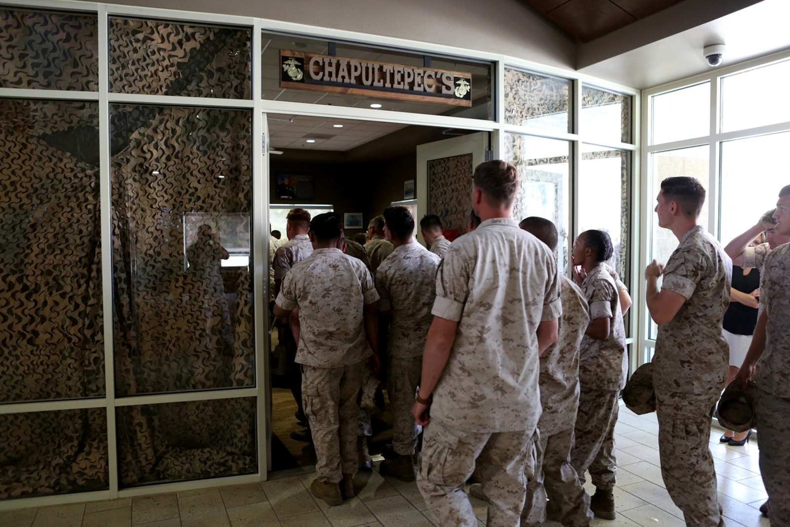 U.S. Marine non-commissioned officers from 7th Engineer Support Battalion enter their new NCO lounge, known as Chapultepec’s, in their barracks building aboard Camp Pendleton, Calif., April 15, 2016. The newly opened lounge is dedicated to give the NCOs a place in the barracks to come together and unwind, forming stronger camaraderie in their ranks. (U.S. Marine Corps photo by Cpl. Carson Gramley/released)