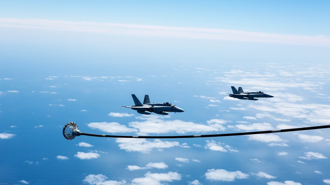 Spanish Air Force F/A-18 Hornets with 462 Squadron prepare to receive fuel from a U.S. Marine Corps KC-130J with Marine Aerial Refueler Transport Squadron 252, Special-Purpose Marine Air-Ground Task Force-Crisis Response- Africa during an aerial refuel mission, Gran Canaria, Spain, Mar. 29, 2016. SPMAGTF-CR-AF Marines and Spanish airmen conducted air-to-air refueling missions in order to enhance crisis response readiness and help build relationships between the two militaries. 