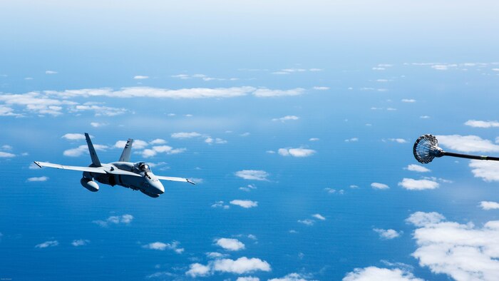 A Spanish Air Force F/A-18 Hornet with 462 Squadron prepares to receive fuel from a U.S. Marine Corps KC-130J with Marine Aerial Refueler Transport Squadron 252, Special-Purpose Marine Air-Ground Task Force-Crisis Response- Africa during an aerial refuel mission, Gran Canaria, Spain, Mar. 29, 2016. SPMAGTF-CR-AF Marines and Spanish airmen conducted air-to-air refueling missions in order to enhance crisis response readiness and help build relationships between the two militaries. 